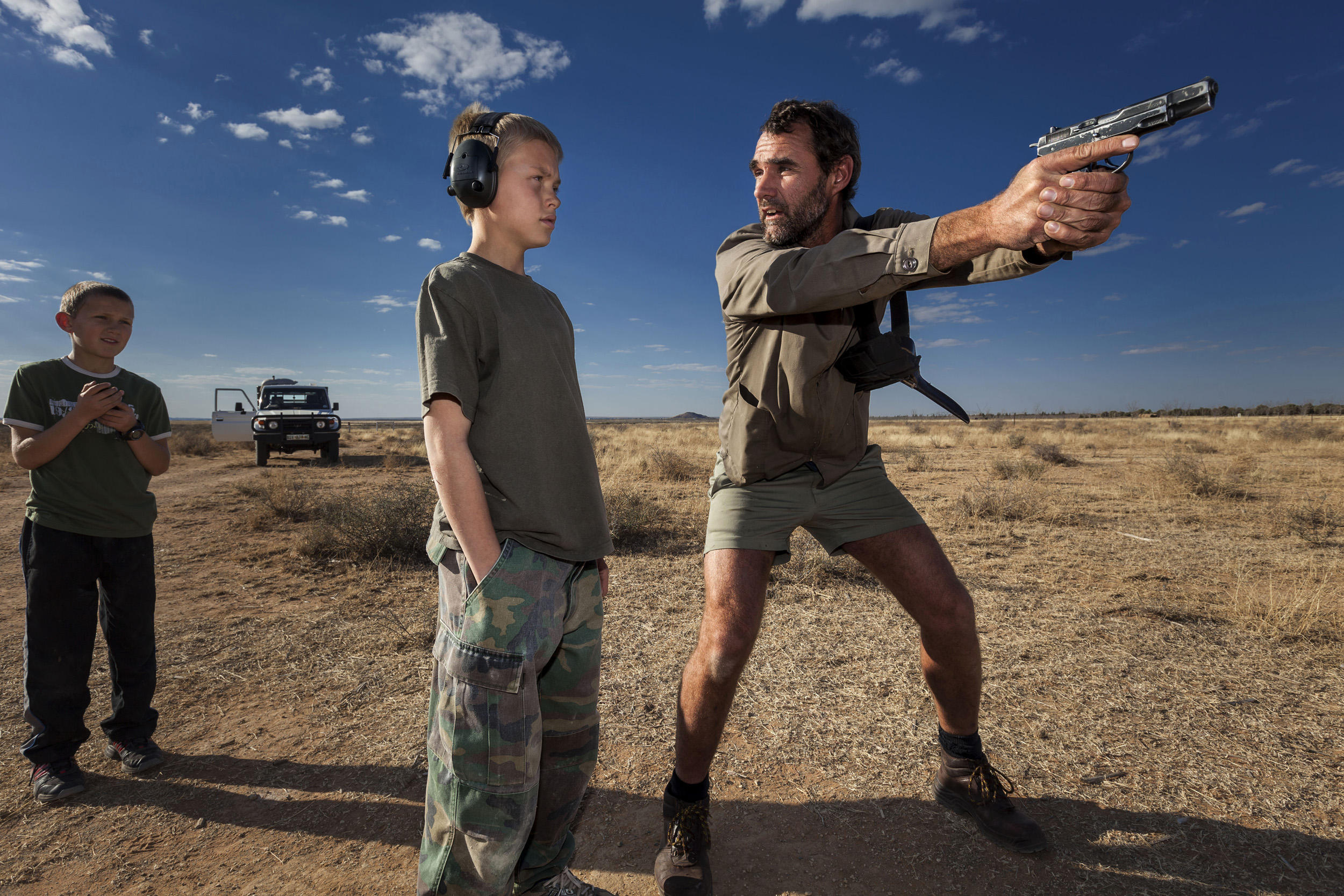 ORANIA, NORTH WEST CAPE PROVINCE, SOUTH AFRICA: Niklas Kirsten, an Orania resident and former South African Army Paratrooper, teaches Erik Du Pree hand-gun self-defence in the fields outside Orania, South Africa. Orania is a privately owned South A