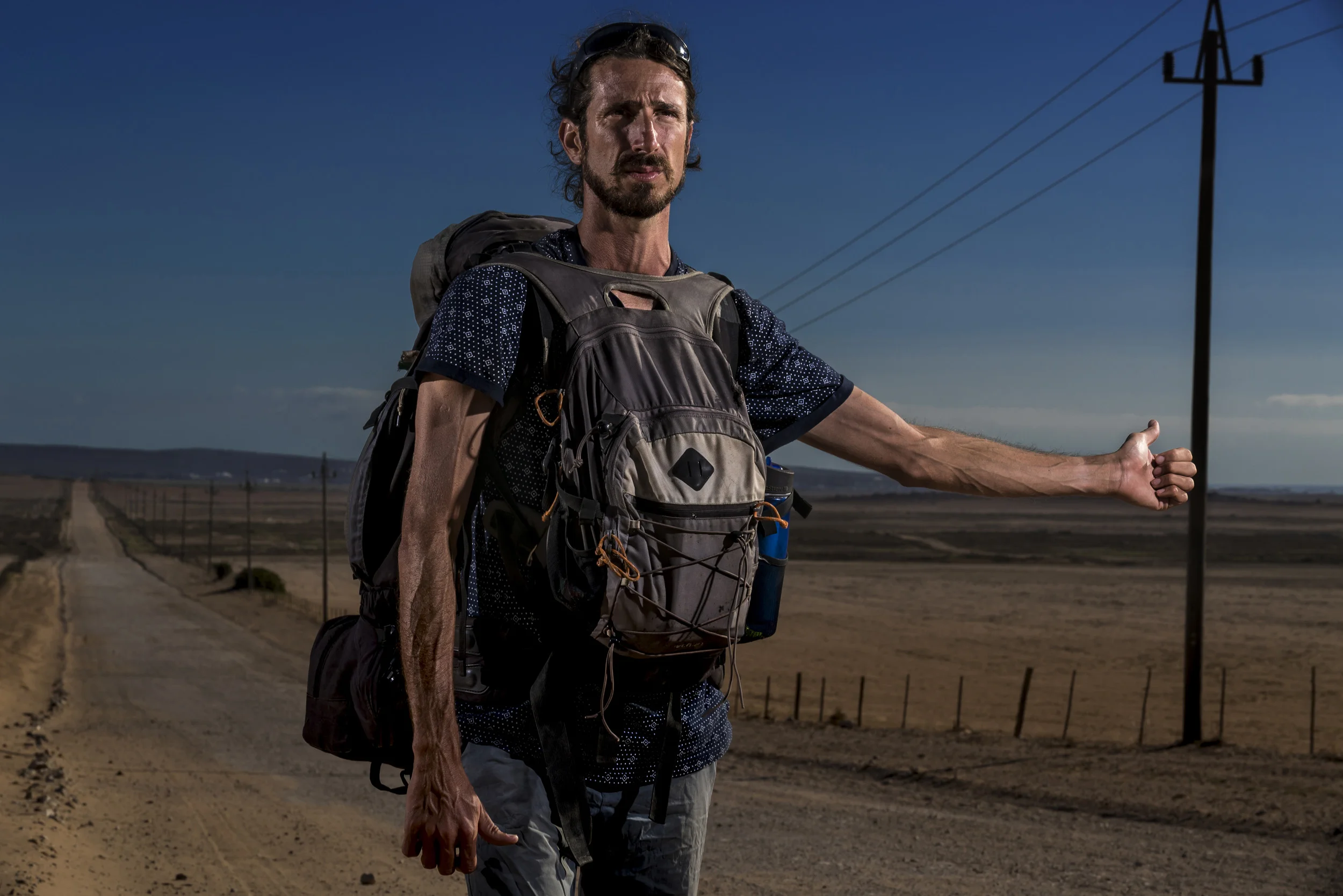 PATERNOSTER, SOUTH AFRICA, 2 APRIL 2017: Juan Villarino stands on a dirt road trying to hitch to from St Helena Bay to Paternoster. (Photo