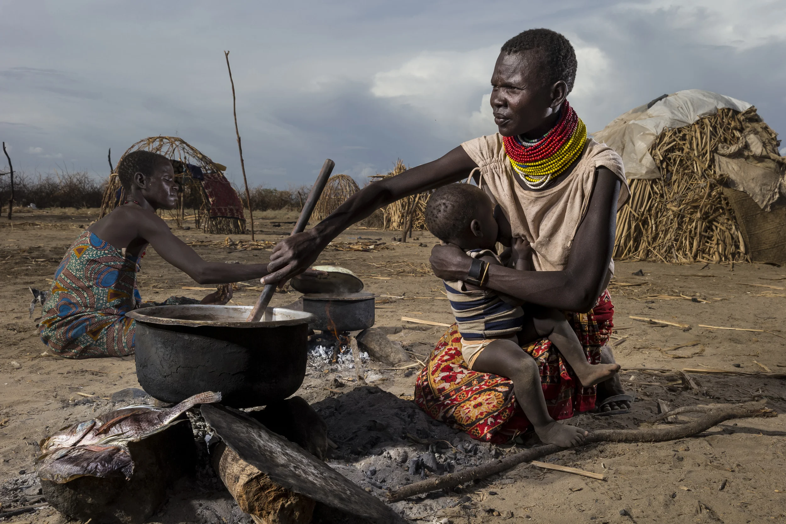 LOWARENGAK, TURKANA, KENYA, 10 OCTOBER 2014: Images from an internally displaced Turkana community who have been moved off their land by Dassanech tribesman who raided their cattle and killed their people, Turkana, Kenya. These Turkana now practise fishing as opposed to their traditional pastoralism as their main means of subsistence. The Dassenech have in fact come illegally over the Ethiopian border into Turkana land. They were pressured by sugar cane farms on the lower Omo river which is the main tributary for Lake Turkana, the largest desert lake in the world. These sugar cane farms robbed the Dassenech of tradional grazing land and water rights and so they moved over the border into Turkana territory and ongoing conflict is the result. This pattern is likely to increase as Ethiopia's Gibe 3 dam comes online next year. This will reduce the flow of the Omo river to one fifth of its current size. This will decimate the fertile flood plain in the region and the tribesmen along the Omo will fight for diminishing resources as a result. This conflict will be likely to continue in Kenya's Turkana region as all around the lake hundreds of thousands of tribespeople will find themselves competing for less and grazing, fishing and clean water sources. A series of droughts have reduced most of these pastoralists to fishing as their chief source of subsistence due to huge cattle and goat deaths. The massively reduced flow of the Omo, source of 90% of Lake Turkana's water, could have a devastating effect on this food and income source. The Ethiopian government has conducted no Environmental Impact Assessment for their dams and has yet to respond to these issues. (Photo by Brent Stirton/Reportage by Getty Images for HRW.)