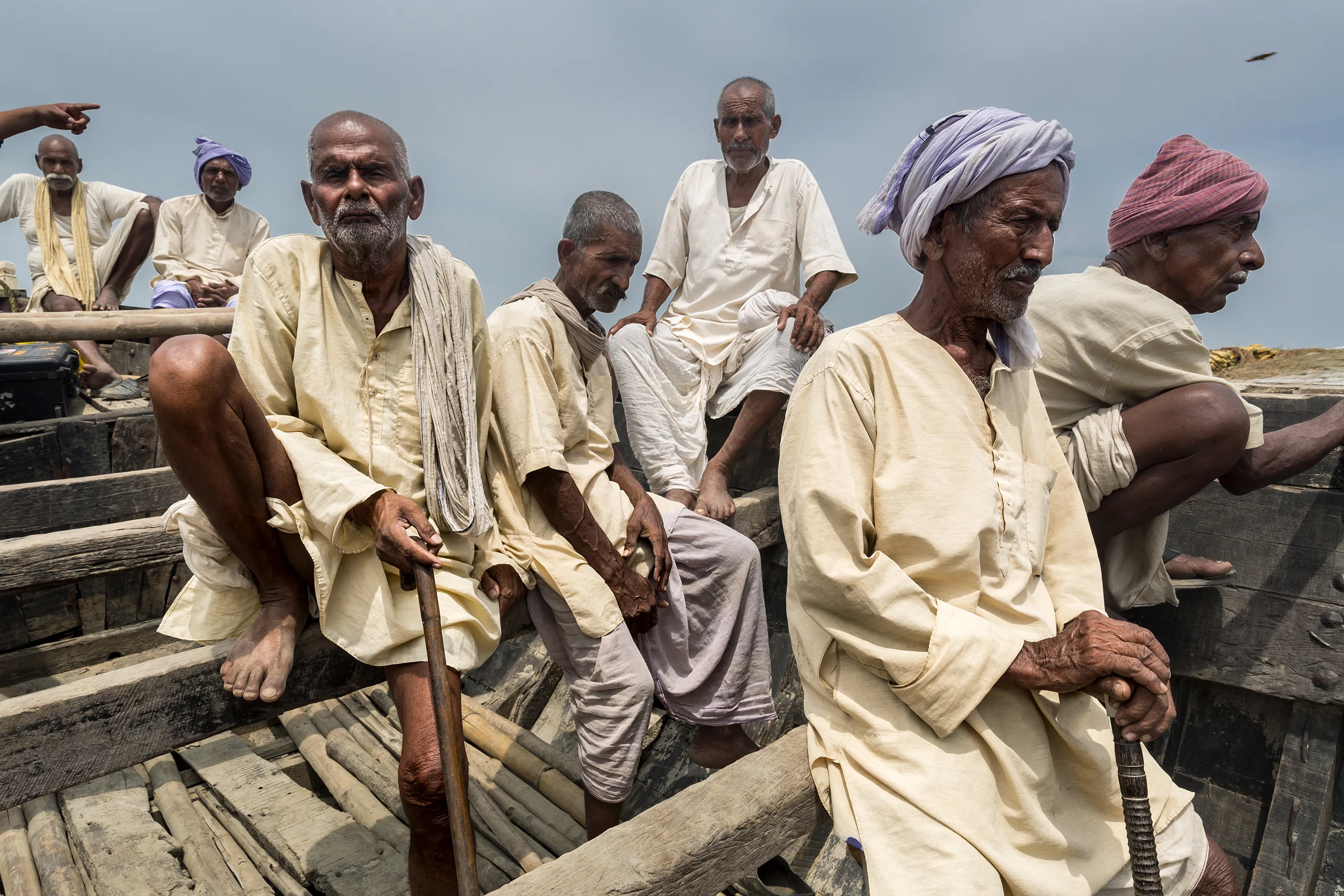 A boat of blind men are rowed to a clinic for blindness in the Sundarban islands.