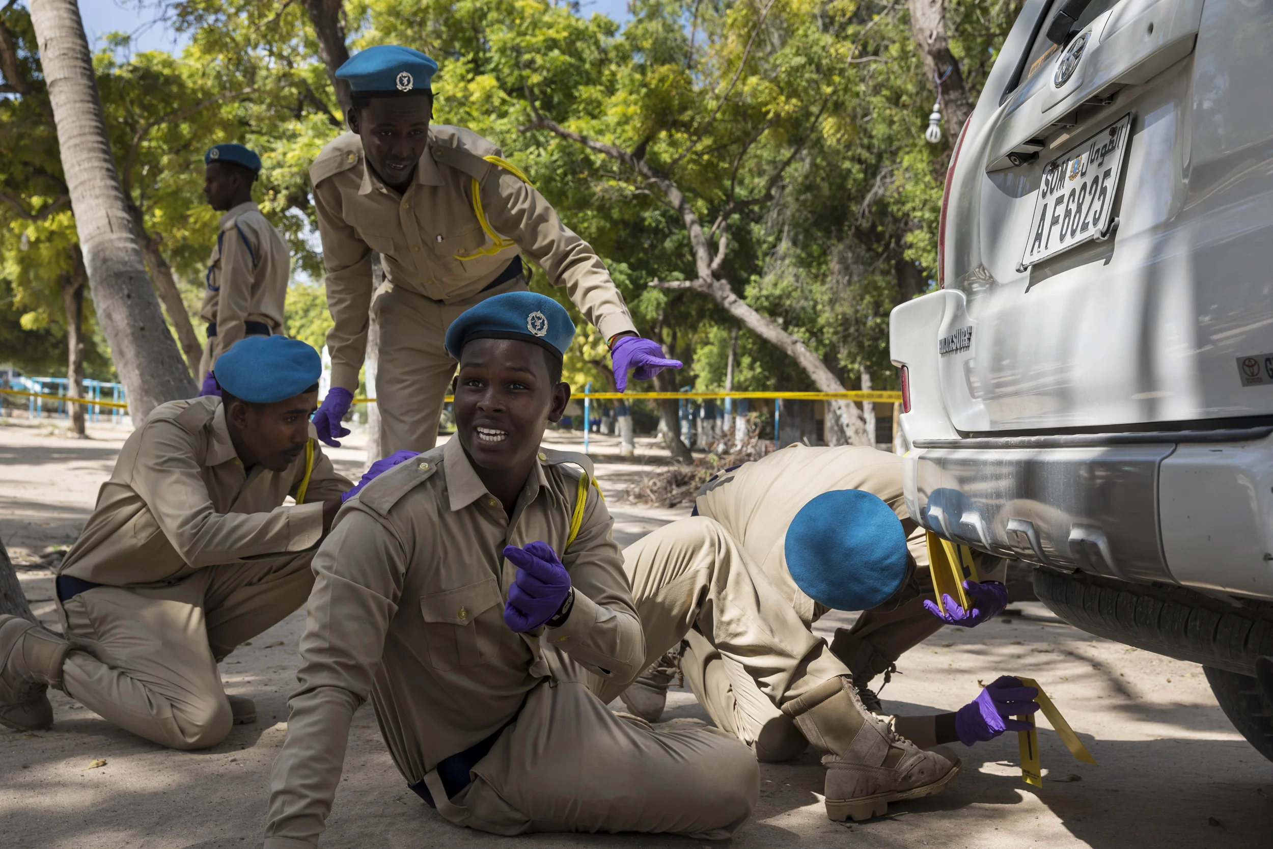 MOGADISHU, SOMALIA, 6 AUGUST 2017: Police candidates attend a crime scene investigation class in Mogadishu. As well as classroom lessons, on this day they are also seen conducting a search of a crime scene involving a vehicle. This policetraining is aided by Bancroft, a US based organization which has the following for its mission statement: "Bancroft Global Development is a multinational, not-for-profit nongovernment organization that implements stabilization initiatives in conflict zones. Through ground-up, citizen-focused education and mentoring, Bancroft Global Development creates conditions that allow individuals to transcend basic survival needs and participate in establishment of culturally appropriate civil order and rule of law." (Photo by Brent Stirton/Verbatim for Time Magazine.)