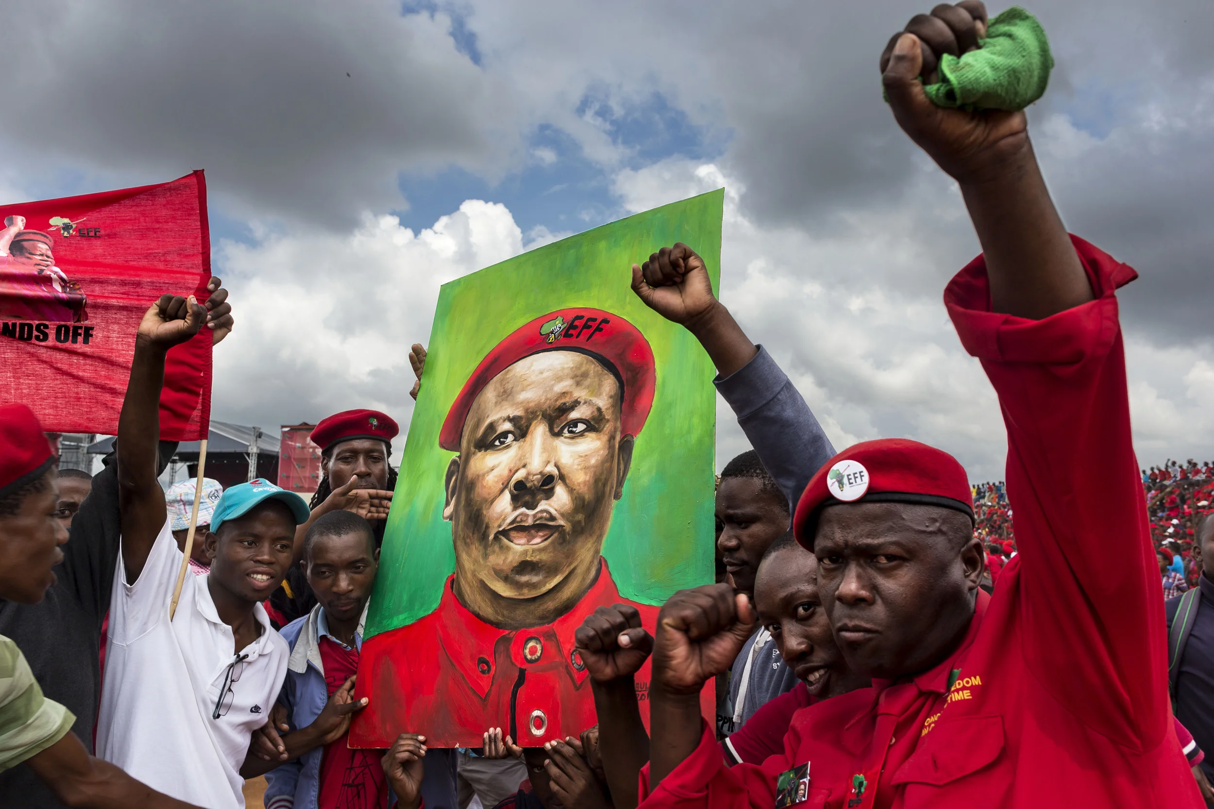 JOHANNESBURG, SOUTH AFRICA, 2 FEBRUARY 2014: The inaugural rally of the Economic Freedom Front, the EFF is a newly formed black right wing party led by disgraced former ANC Youth League President Julius Malema. Malema was forced out of the ANC after attacking President Jacob Zuma repeatedly and faces over 500 criminal charges. He formed the EFF after he was thrown out of the ANC and advocates the policies of Hugo Chavez, Robert Mugabe and Fidel Castro. He wants to nationalize the banks, mines and all major industries, he also wants to disposses white farmers of their land, claiming the whites stole it from former black owners. Historians and academics dispute his claims and he neglects the fact that South Africa has already been through multiple land dispute court claims. Malema regularly uses hate speech against whites and although this is constitutionally illegal he is not prosecuted by governement. He is most famous for revitalisizing and singing "Kill the Boer, kill the farmer," a former protest song from the apartheid period. (Photo by Brent Stirton/Vebatim for Le Figaro.)