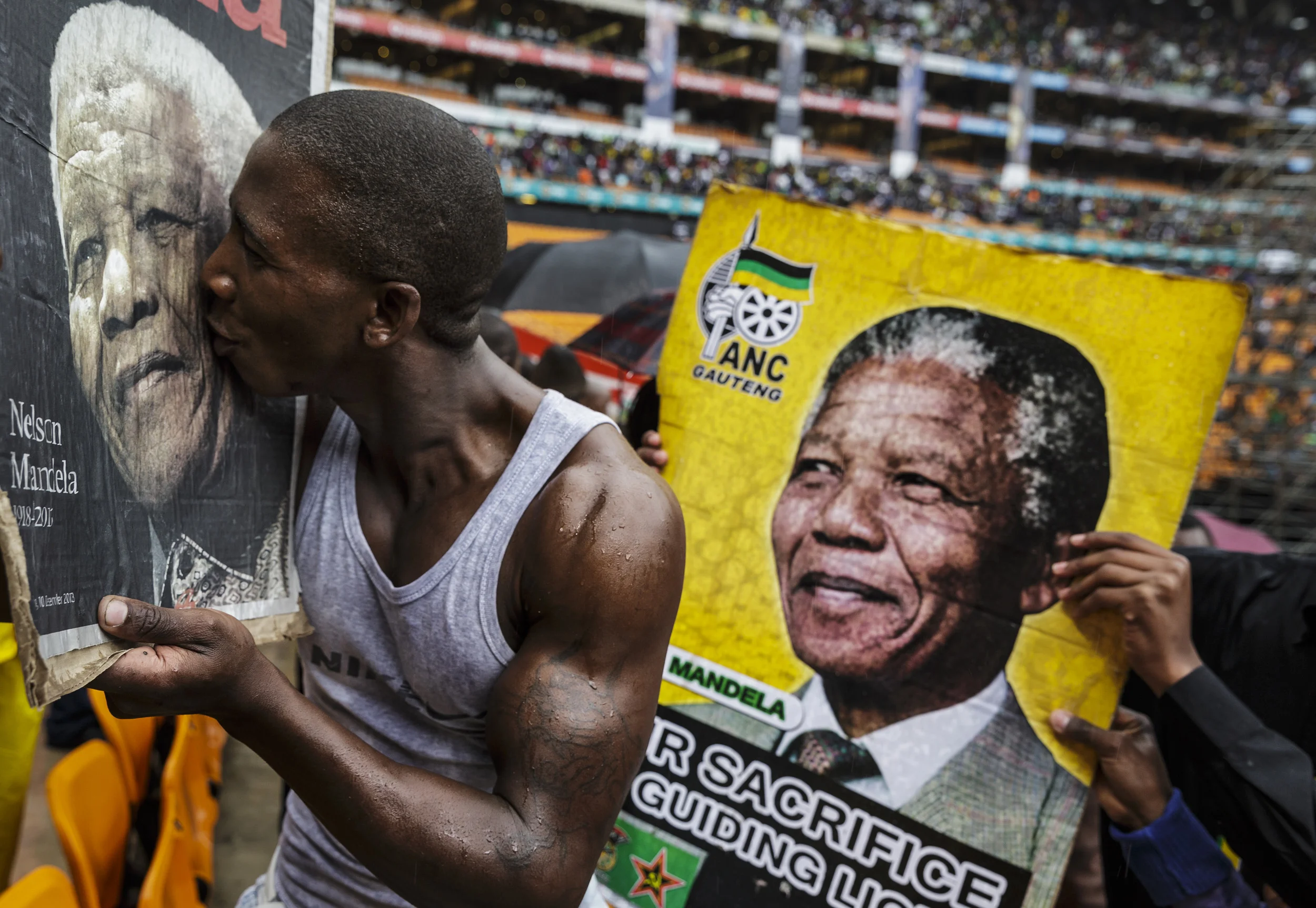 SOWETO, SOUTH AFRICA, 10 DECEMBER 2013: Nelson Mandela supporters gather at FNB stadium for a day of comemoration for Nelson Mandela, the iconic Freedom Fighter of the ANC, Soweto, South Africa, 10 December 2013. Mr Mandela died on the 5th of December 2013. Since Mandela's death however, anti-white speech has become far more vocal in its intensity, especially from Black right wing party, the Economic Freedom Front led by Julius Malema. (Photo by Brent Stirton/Reportage by Getty Images.)