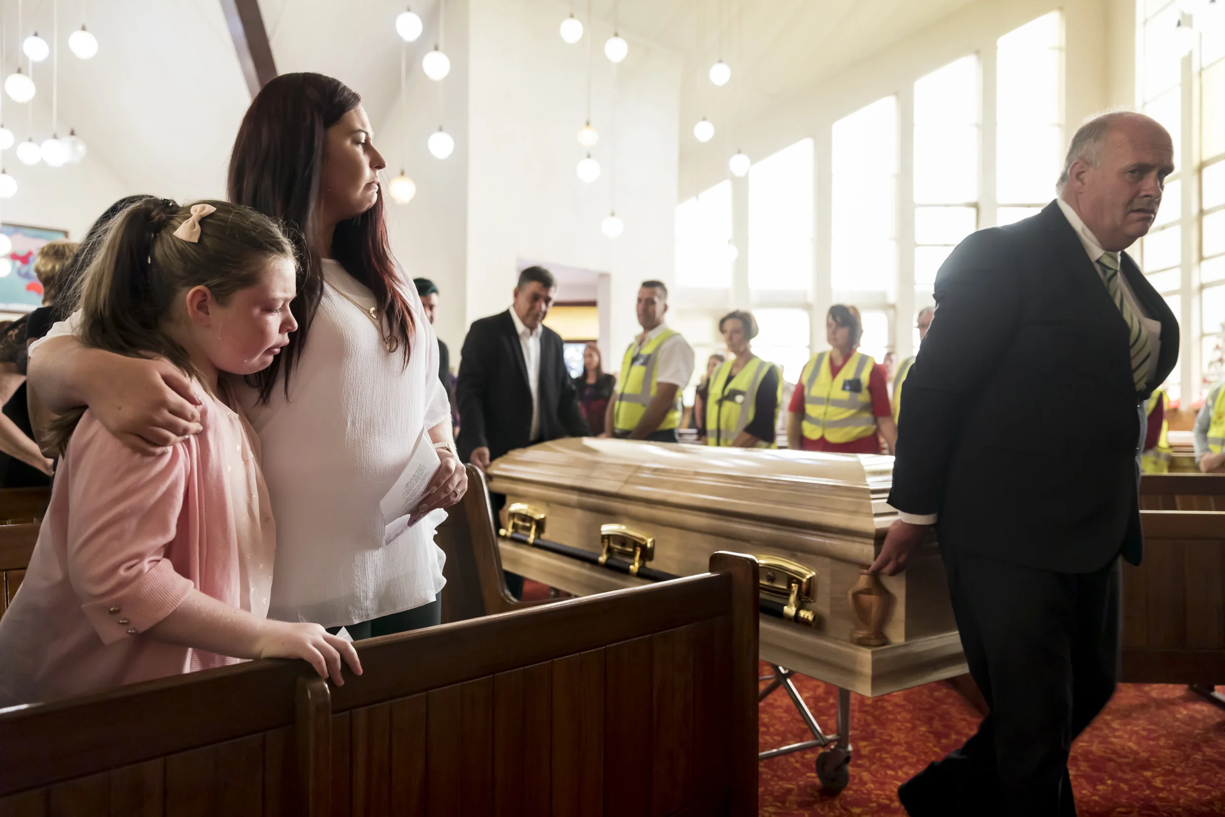 SUNDRA, SOUTH AFRICA, 23 NOVEMBER 2016: The funeral for Kathleen Van Coppenhagen, shot dead by black attackers on her small holding in the farming town of Sundra. Kathleen was found hiding inside the dog kennel after being shot, her husband managed to escape his attackers after they shot his wife and beat him badly. Kathleen was taken to hospital but died a day later. Another white women was stabbed to death in Sundra 2 nights later. According to government, 3398 farmers have been killed in farm attacks since 1994. Farmers and agricultural organization say that number is far higher. The ANC government instructed the police to stop keeping these records as they say it was bad for investment. Right wing groups all say that officially police in South Africa have a 33/100000 chance of being killed every year. Farmers in South Africa have a 158/100000 chance making them the most vulnerable population group in the world. Since 1994 there have been 328 244 murders in South Africa, with over 80 000 whites killed. Farmers in particular have little recourse to the law and must largely protect themselves. They formed Kommando groups to do this but the ANC government banned these. Since then, farmers remain reliant on themselves and small community protection groups. On average, there is a farm attack in South Africa every second day. The vast majority of these attacks involve significant numbers of attackers and violence, torture and rape are common. These attacks have polarized South Africa further and hate speech by black right wing movements has accelerated this. (Photo by Brent Stirton/Verbatim for Le Figaro.)