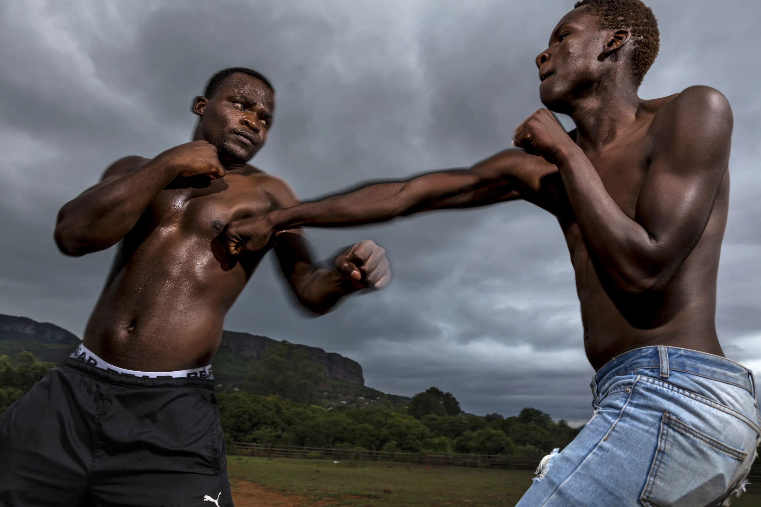 VENDA, SOUTH AFRICA, 11 DECEMBER 2016: Nephalama "Senior" Khodani, a Senior Champion Musangwe fighter. Musangwe is traditional bare knuckle boxing which occurs in Venda every Xmas period. Senior is 24 years old and has been fighting in Musangwe since 2007. He has had more bare knuckle fights than he can count and sees Musangwe as a way of taking fighting off the streets and onto a more sportsman like field. He says that when he was younger he was always fighting and his elders told him if he was going to fight he needed to do Musangwe. Senior is seen sparring with a friend on the actual Musangwe fighting ground in Venda and in portraits close to the capital Thoyando. (Photo by Brent Stirton/Verbatim for Le Figaro.)
