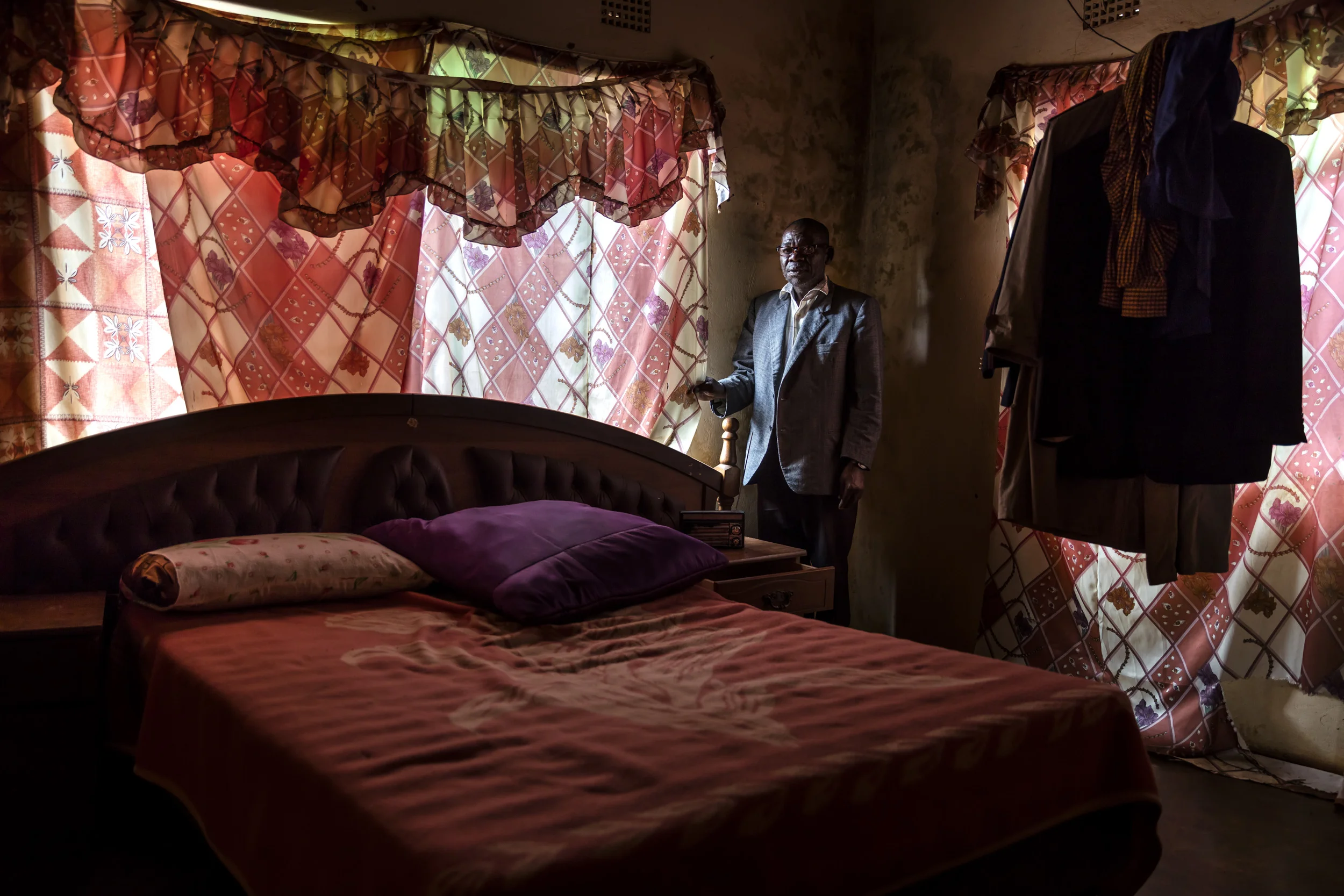 VENDA, SOUTH AFRICA, 11 DECEMBER 2016: Chief Boana Madzhuta, the tradional leader of Gaba village. The Chief's permission must be granted every year before Musangwe can begin. Musangwe is traditional bare knuckle boxing which occurs in Venda every Xmas period. The Chief is seen in his bedroom. He states that he'd like Musangwe to bring in more tourism so that his village can grow and improve. (Photo by Brent Stirton/Verbatim for Le Figaro.)