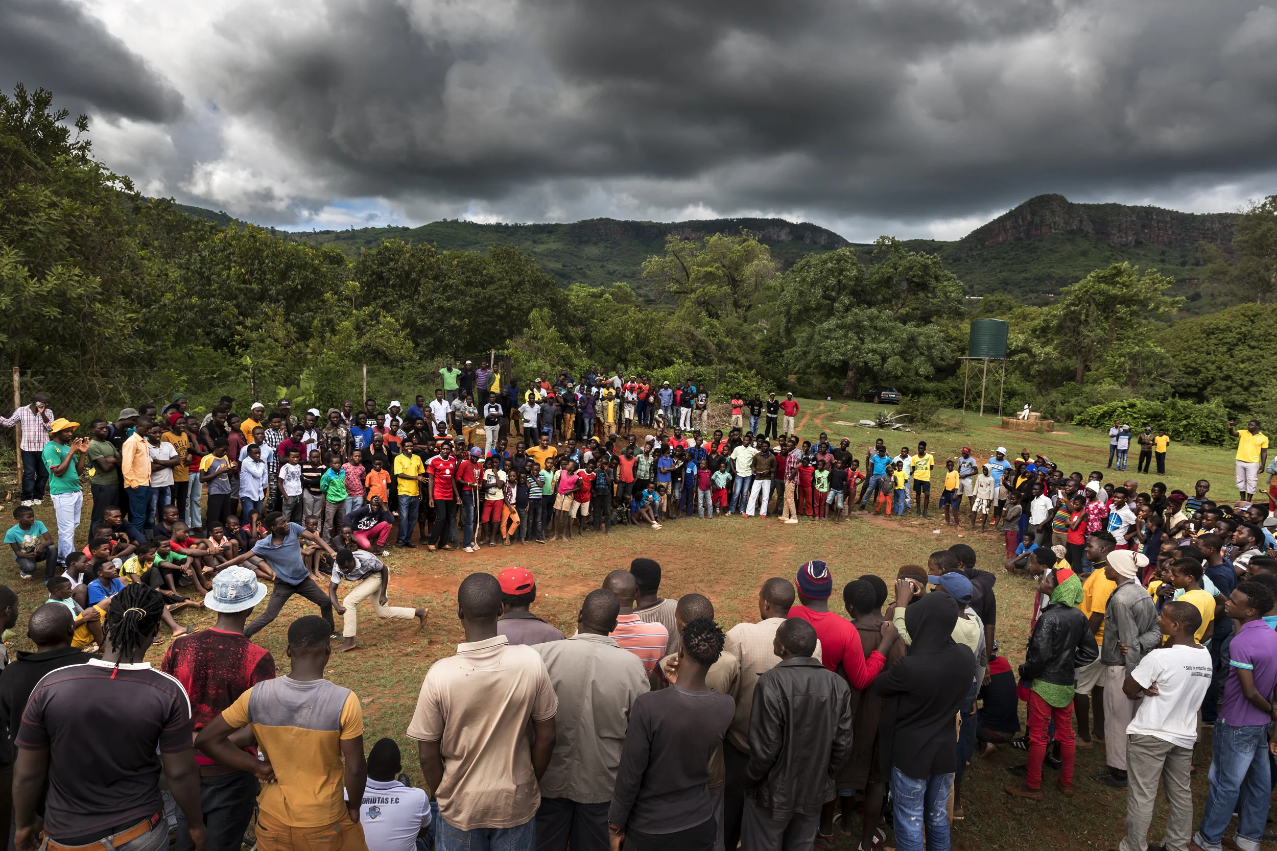TSHIFIDI, VENDA, SOUTH AFRICA, 15 DECEMBER 2016: Men and boys of the Venda tribe challenge each other and fight bare knuckle over the festive period in South Africa. This is a tradition that dates back 200 years and began when herd boys tried to get their cattle bulls to fight with each other while they were being dipped for disease. The herd boys soon began to fight with each other and this became a tradition. The fighters may stop at any time and if a fighter starts bleeding the fight is stopped. It is seen a an outlet for the males in the community and nowadays there are champions on three different levels. (Photo by Brent Stirton/Verbatim for Le Figaro.)