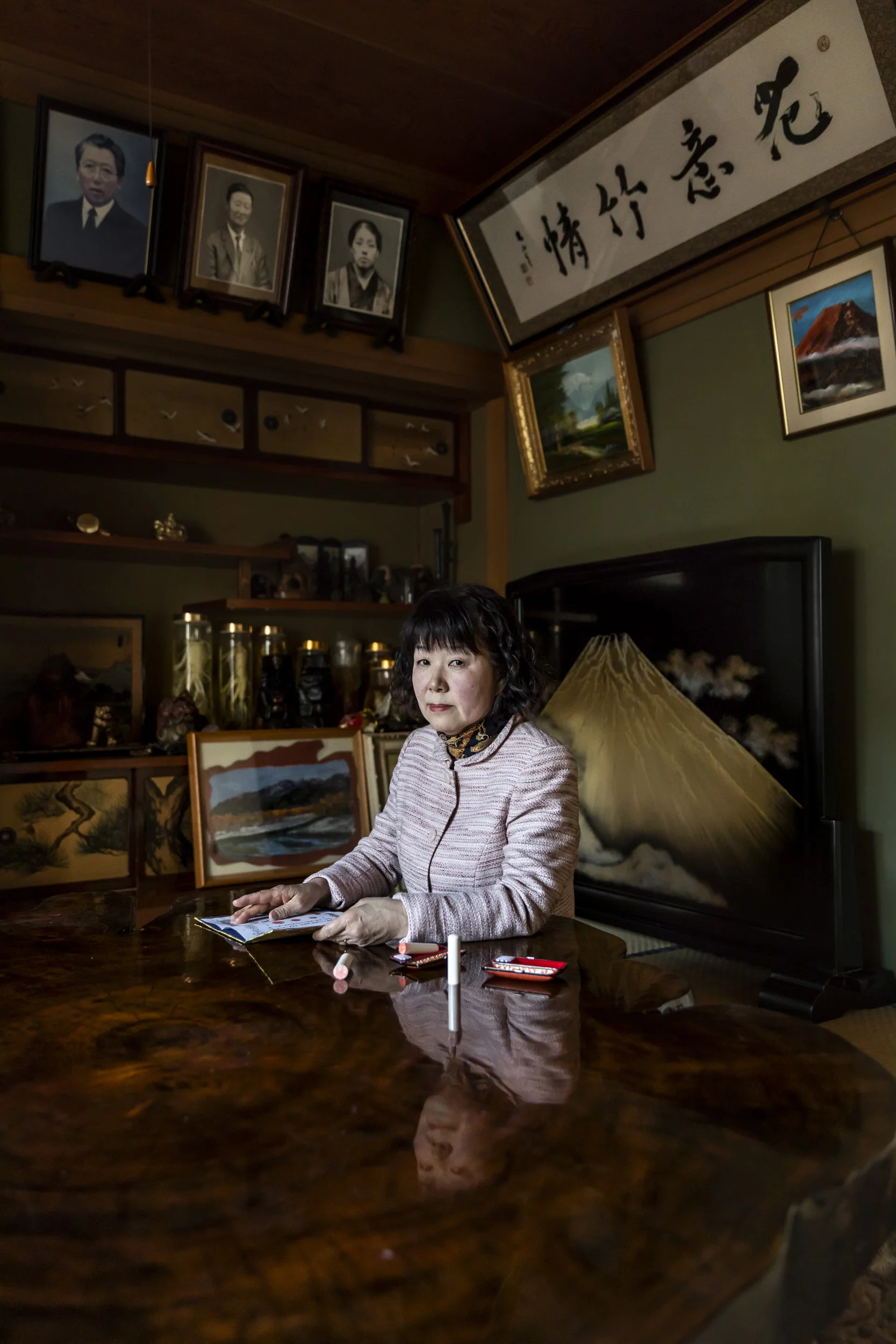 Japan, 14 April, 2018: Kaiko, 62, a Japanese woman, is seen with three ivory Hankos she has purchased in the last ten years. She bought the first one from a door to door salesman and that is unregistered ivory. The other two she bought more recently for her son for an upcoming auspicious occasion. These were accompanied by a registration certificate stating the ivory came from a legal source. Kaiko bought her hanko because her parents died and she felt she needed a special personal seal for the property changes. Many Japanese have a strong belief in the use of a special Hanko for good fortune. Kaiko says, “One Hanko can change a persons life. My parents always told me, don’t use your Hanko very often, it decides your fate.” Kaiko paid 30, 000 Yen for her Hanko, but paid 300, 000 Yen for her sons. Prices have risen steadily making the ivory Hanko market strong in Japan. “When I die, I hope my children will place my Hanko in my coffin with me.” (Photo by Brent Stirton/Verbatim by Getty Images.)