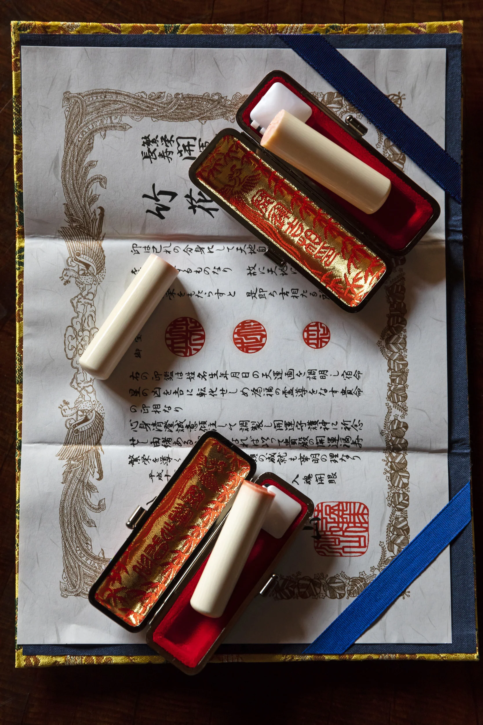 Japan, 14 April, 2018: Kaiko, 62, a Japanese woman, is seen with three ivory Hankos she has purchased in the last ten years. She bought the first one from a door to door salesman and that is unregistered ivory. The other two she bought more recently for her son for an upcoming auspicious occasion. These were accompanied by a registration certificate stating the ivory came from a legal source. Kaiko bought her hanko because her parents died and she felt she needed a special personal seal for the property changes. Many Japanese have a strong belief in the use of a special Hanko for good fortune. Kaiko says, “One Hanko can change a persons life. My parents always told me, don’t use your Hanko very often, it decides your fate.” Kaiko paid 30, 000 Yen for her Hanko, but paid 300, 000 Yen for her sons. Prices have risen steadily making the ivory Hanko market strong in Japan. “When I die, I hope my children will place my Hanko in my coffin with me.” (Photo by Brent Stirton/Verbatim by Getty Images.)