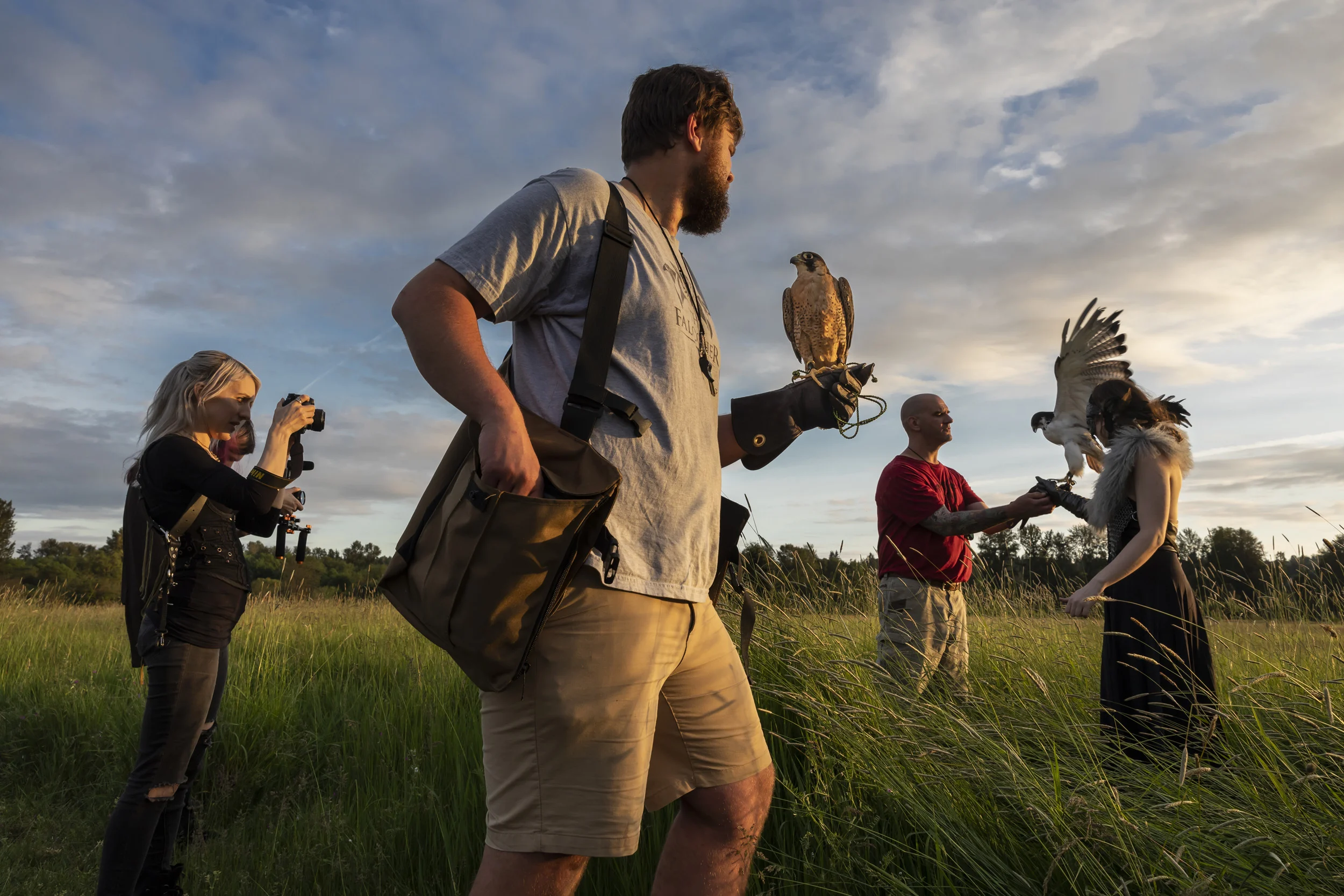SEATTLE, WASHINGTON STATE, USA, 26 MAY 2018: Falconry handler John Prucich, also known as the FalcOner, wrangles falcons, owls and buzzards on a photo shoot. John runs a Seattle based company specializing in "all things birds of prey." On this day he was working with Fine Art photographer Kindra Nikole Timmerwilke and model Rachel Dooley as they photographed a series of fantasy scenes in the wilderness around Seattle. John worked with a buzzard, two falcons and two owls to help Kindra and Rachel achieve the vision they have for this series of fine art images. Raptors and especially falcons, are a part of mythology in many cultures and are held up as icons of power and grace around the world. We see them on currency, in superhero comics and films and across the Arab world as a powerful symbol. (photo by Brent Stirton/Getty Images for National Geographic Magazine.)
http://www.the-falconer.com/about
