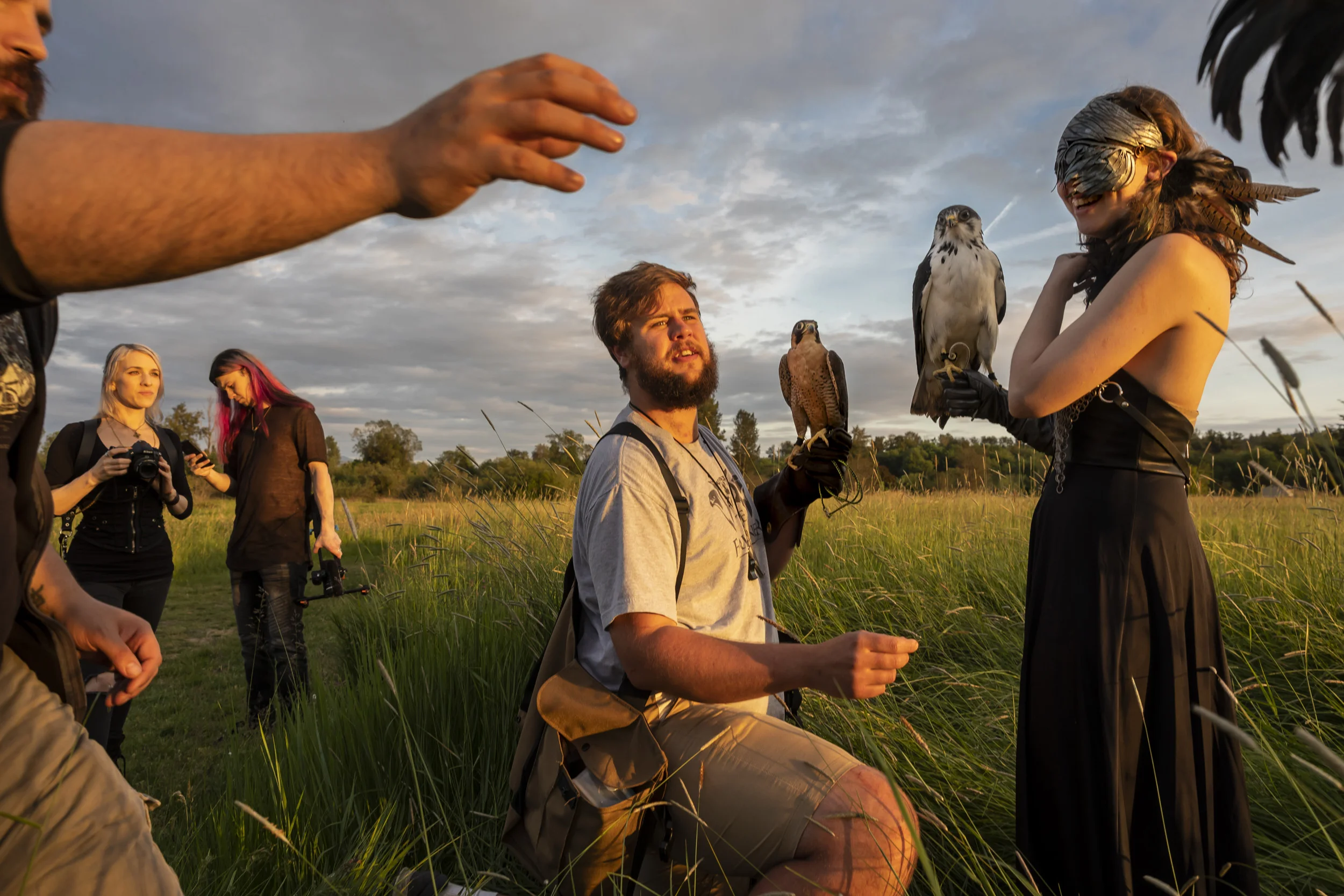 SEATTLE, WASHINGTON STATE, USA, 26 MAY 2018: Falconry handler John Prucich, also known as the FalcOner, wrangles falcons, owls and buzzards on a photo shoot. John runs a Seattle based company specializing in "all things birds of prey." On this day he was working with Fine Art photographer Kindra Nikole Timmerwilke and model Rachel Dooley as they photographed a series of fantasy scenes in the wilderness around Seattle. John worked with a buzzard, two falcons and two owls to help Kindra and Rachel achieve the vision they have for this series of fine art images. Raptors and especially falcons, are a part of mythology in many cultures and are held up as icons of power and grace around the world. We see them on currency, in superhero comics and films and across the Arab world as a powerful symbol. (photo by Brent Stirton/Getty Images for National Geographic Magazine.)
http://www.the-falconer.com/about