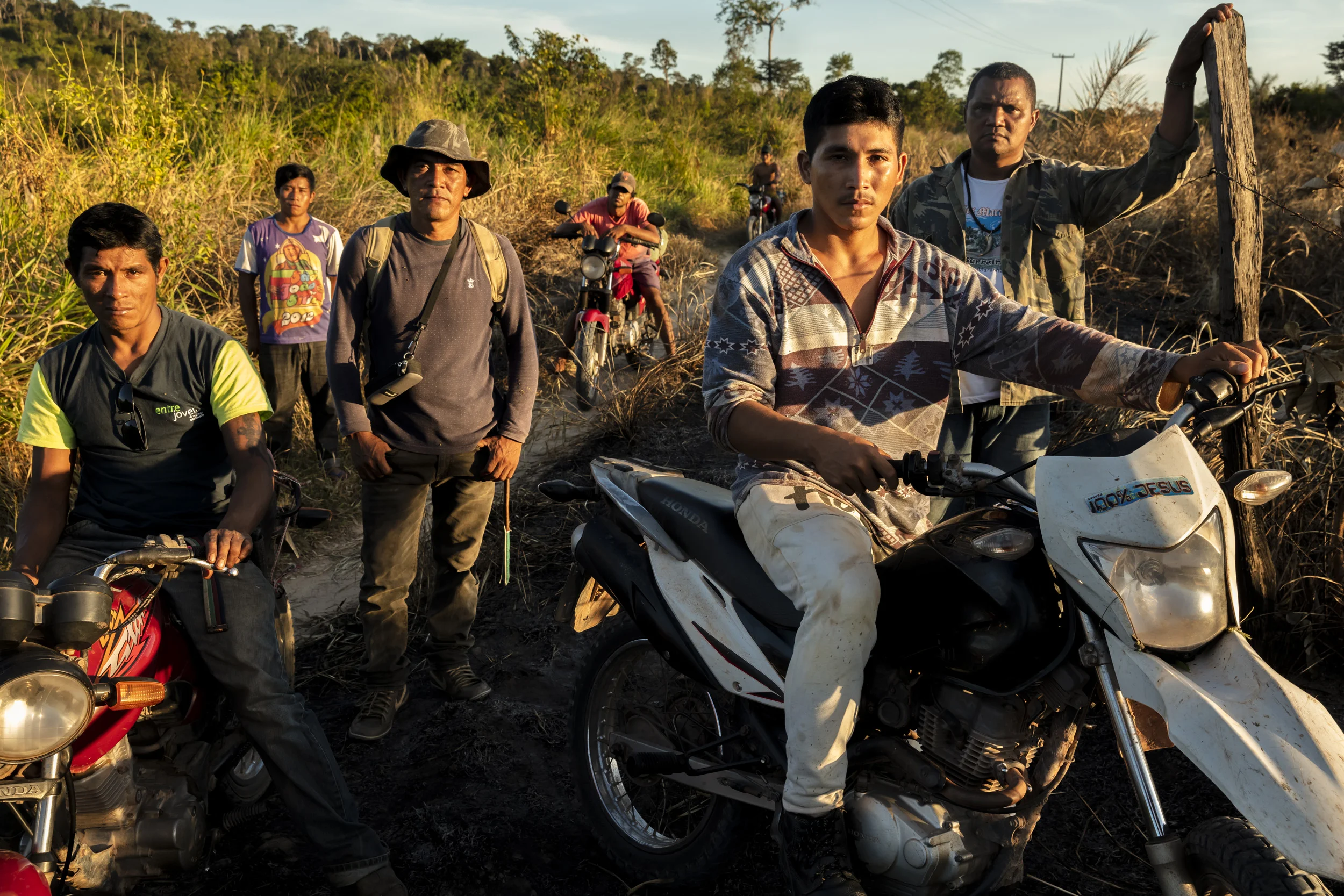 MARANHAO, BRAZIL, JUNE 2018: Members of the Forest Patrol from the village of La Goa Comprida in Arariboia Indigenous territory. In this village illegal loggers attacked locals when the locals confiscated their logging vehicles. One indigenous man, Tomes, was killed defending his wife and a logger was also shot. Tomes is survived by 2 daughters Graca Guajajara and Jaciane Guajajara. They remain in a deeply saddened state about his killing to this day. This village has little real funding but they continue to send out forest patrols they call forest guardians. This consists of motorbike patrols when they have fuel. Arariboia is the ancestral territory of the Guajajara, it encompasses 413,000 hectares of Amazon forest. The Guajajara share this land with the Awá Guajá, who live in voluntary isolation. Arariboia is the most populated territory we visited, with visible signs of deforestation in the areas we visited. The Guajajara have been organised since 2013 to monitor their territory, they call these patrols Indigenous Environmental Inspectors (Agentes Indígenas Ambientais). Arariboia is divided in 8 regions and each region has 15 inspectors, they all answer to one General Coordinator. In turn, the General Coordinator answers to a council of village chiefs. The inspectors received some funding for several years from FUNAI for transport and food expenses, in addition to some basic training. However, the funding stopped in 2015. Guajajara inspectors have engaged in violence against the loggers they apprehend, including beatings and setting on fire their equipment. These acts of violence seem to have taken place under the supervision of Olimpo Guajajara, who was reportedly removed from his position for these incidents. The Guajajara foresee no community enforced sanctions when their own are complicit in environmental crimes. The Guajajara will often acknowledge widespread participation of their own people in environmental crimes, including three village chiefs. Guajaj