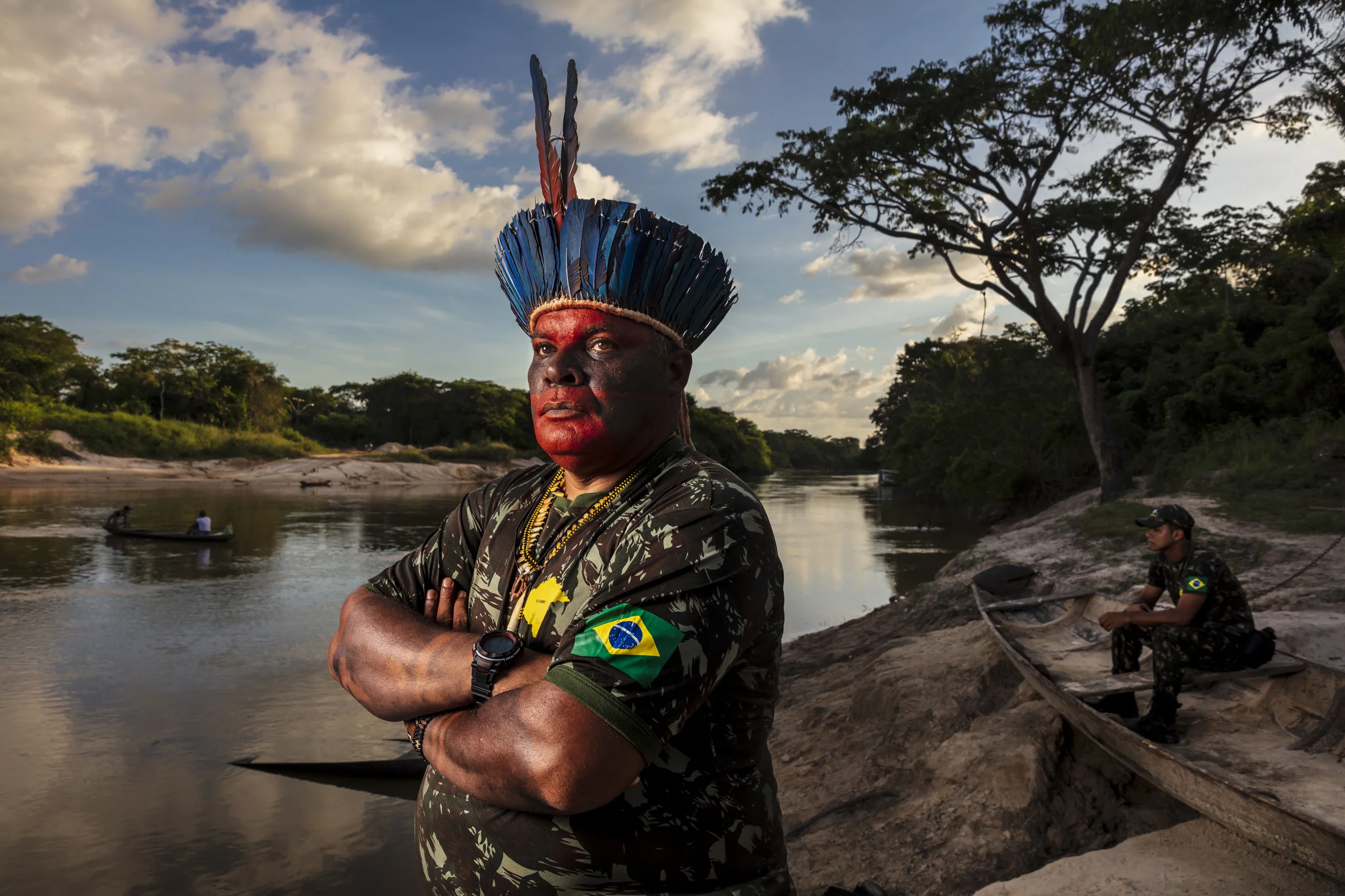 MARANHAO, BRAZIL, JUNE 2018: Chief Antonio Wilson Guajajara from the village of Macaranduba in the Karu Indigenous Territory. He is seen being painted in traditional patterns before a patrol and also on the bank of the river flowing through his territory. This village has experienced many problems with illegal loggers and have used their settlement funds from a mining dispute to create an organized patrol of forest guardians. The women of the village have learnt to fly a drone and work together with the men to reinforce these patrols. In 2013 there was much disharmony in the village but this was successfully resolved, largely thanks to pressure from the women in the village. Those who were working with illegal loggers were expelled and from that time there has been solidarity in working towards the preservation of the forest. (Picture by Brent Stirton/Getty Images for Human Rights Watch.)