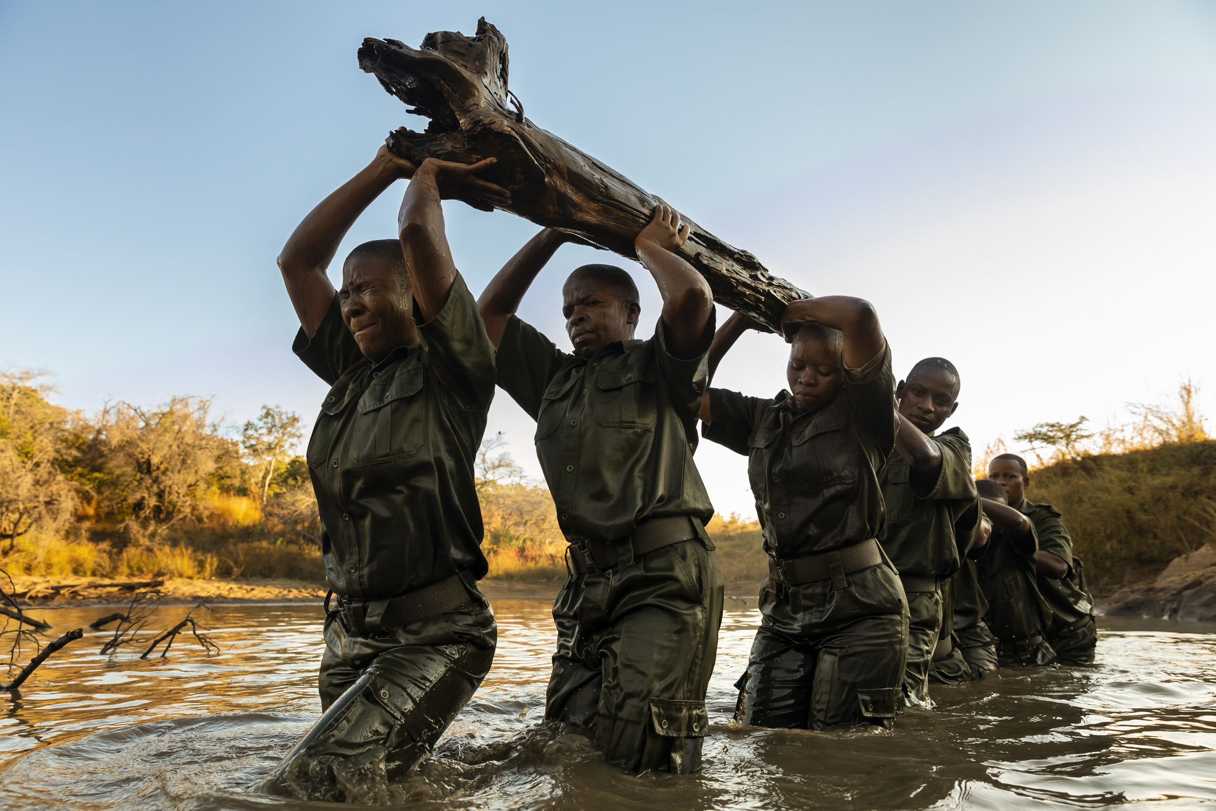 PHUNDUNDU WILDLIFE AREA, ZIMBABWE, JUNE 2018: Members of the all female conservation ranger force known as Akashinga undergo tough training in the bush near their base. Akashinga (meaning the ‘Brave Ones’ in local dialect) is a community-driven cons