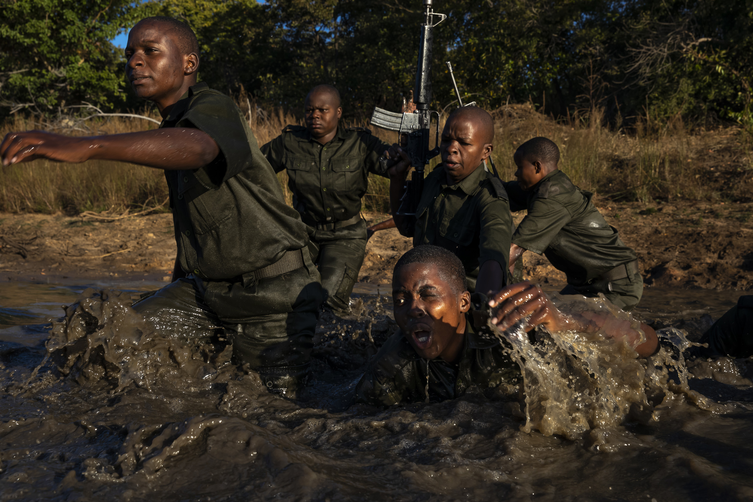 PHUNDUNDU WILDLIFE AREA, ZIMBABWE, JUNE 2018: Members of the all female conservation ranger force known as Akashinga undergo tough training in the bush near their base. Akashinga (meaning the ‘Brave Ones’ in local dialect) is a community-driven cons