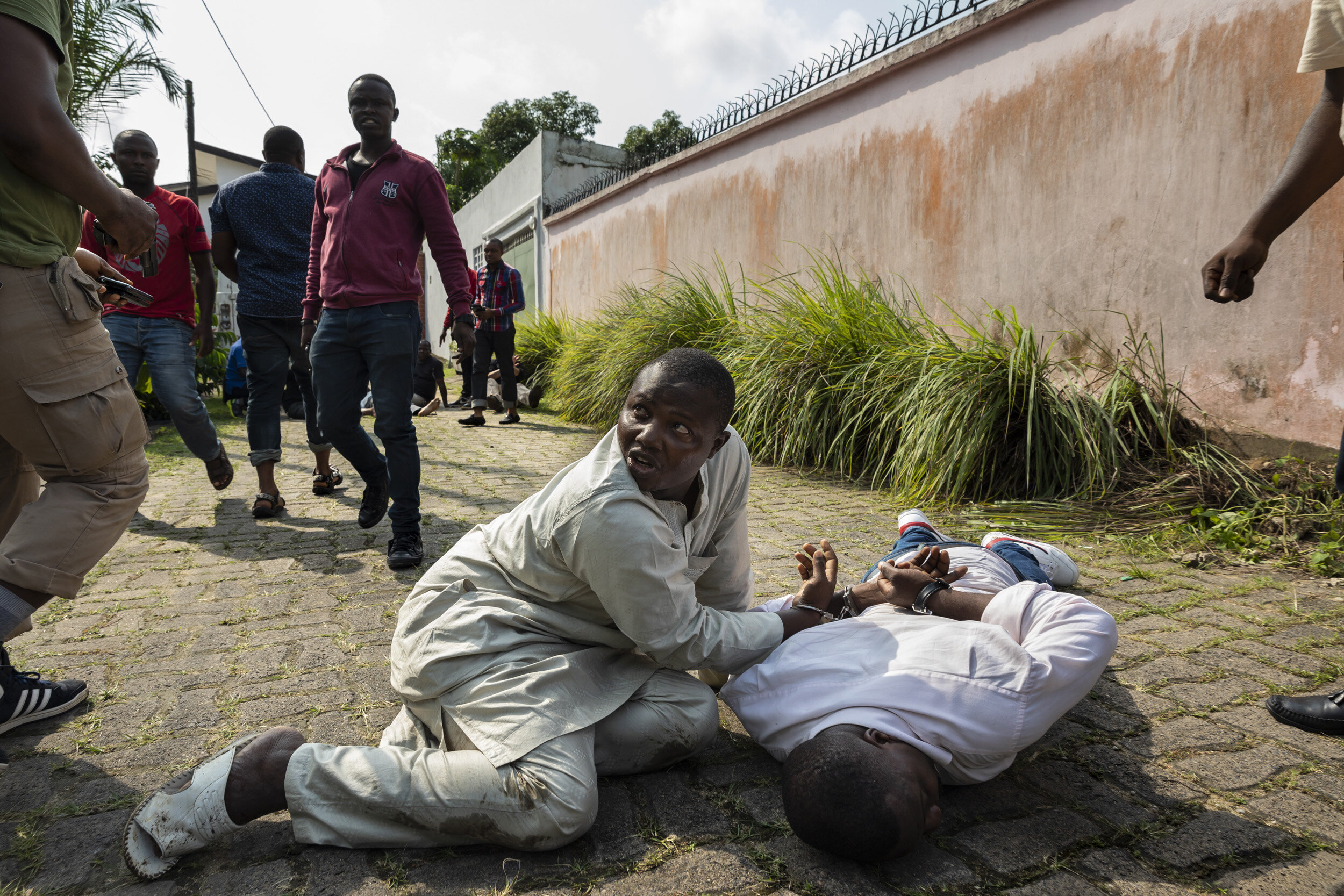 DOUALA, CAMEROON, 18 AUGUST 2018: Members of the Ministry of Wildlife, undercover Police and undercover members of LAGA, a wildlife law enforcement agency capture a group of 5 men who tried to sell one thousand kilograms of giant pangolin scales to