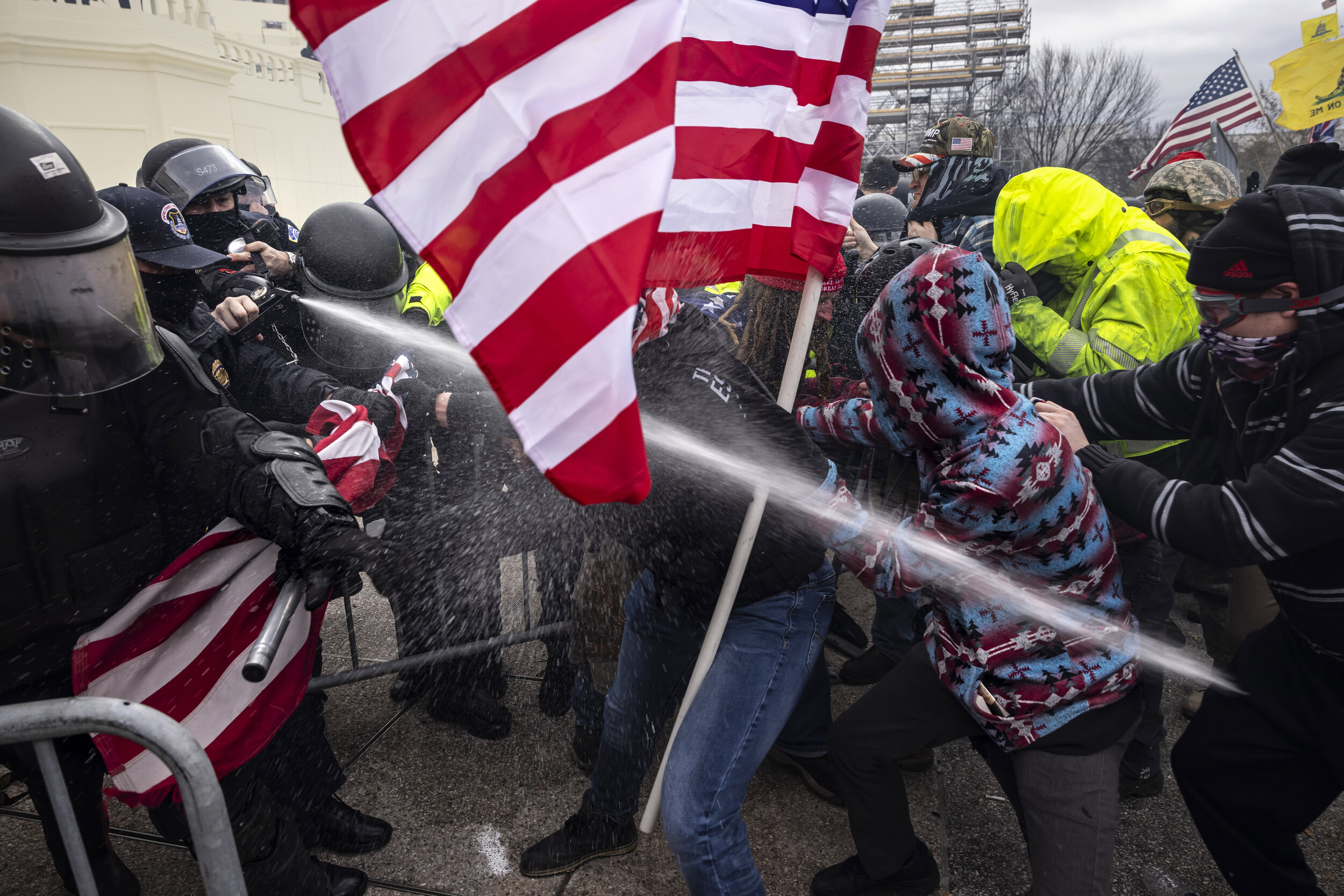 WASHINGTON D.C., USA - JANUARY 6: Trump supporters clash with police and security forces as people try to storm the US Capitol in Washington D.C on January 6, 2021. Demonstrators breeched security and entered the Capitol as Congress debated the 2020