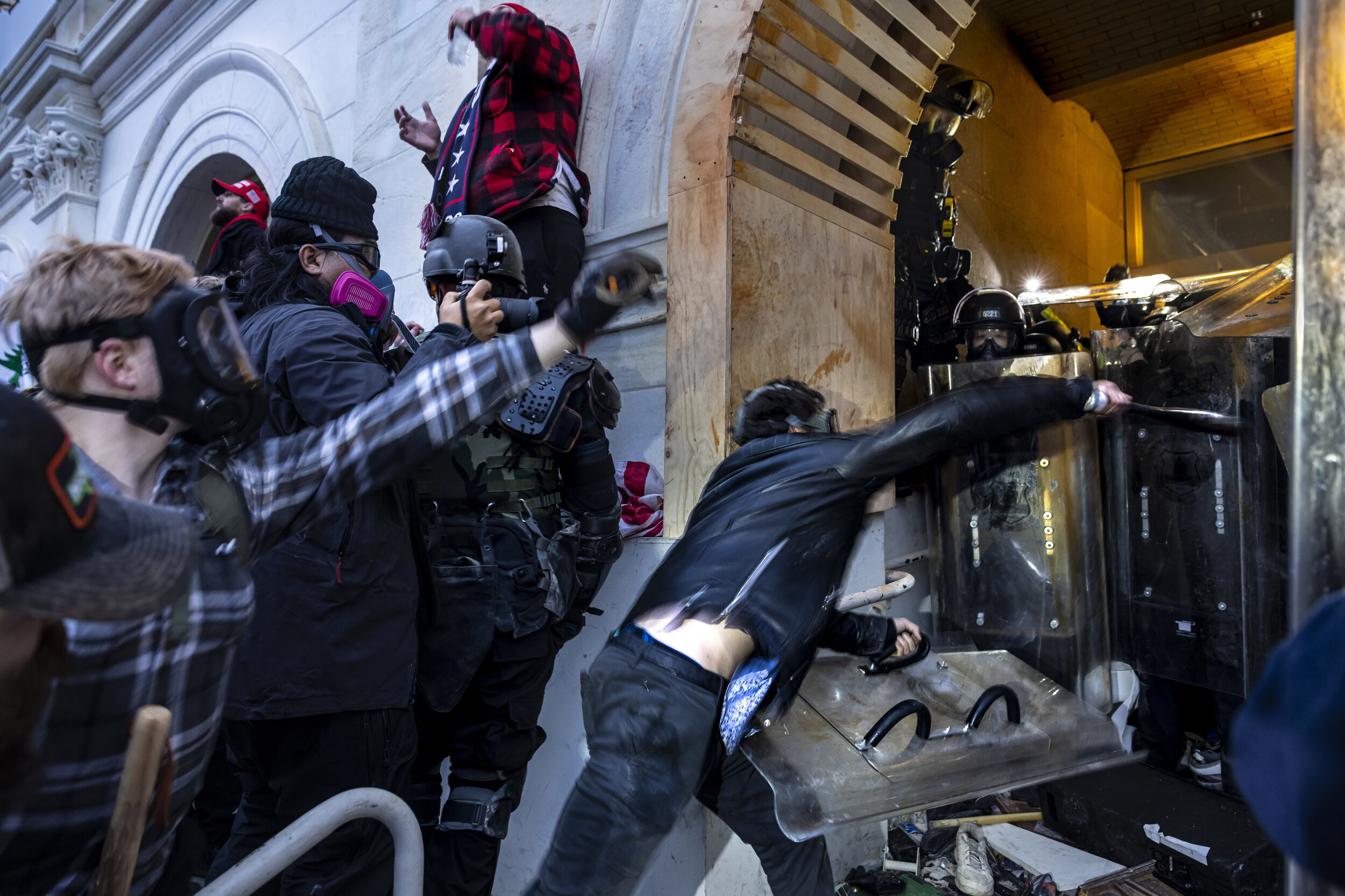 WASHINGTON D.C., USA - JANUARY 6: Trump supporters clash with police and security forces as people try to storm the US Capitol in Washington D.C on January 6, 2021. - Demonstrators breeched security and entered the Capitol as Congress debated the 20