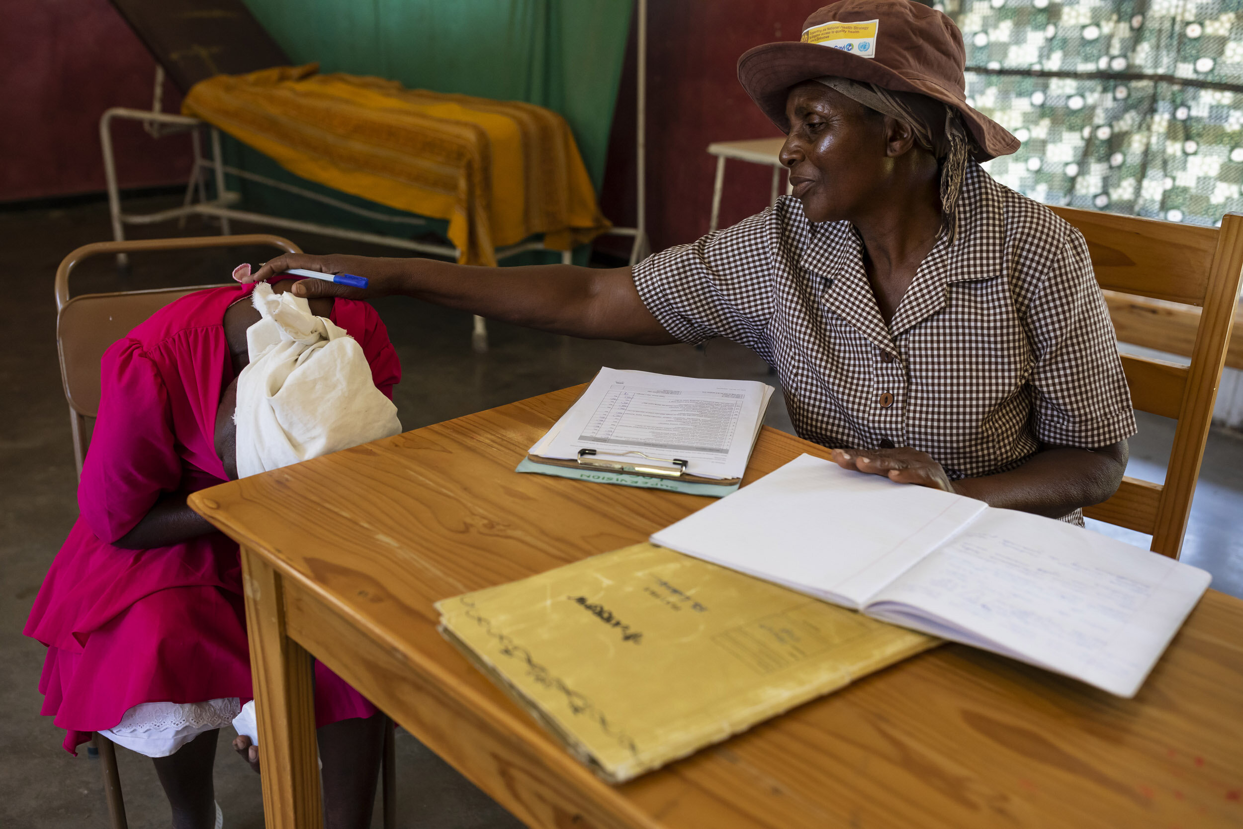 ZAKA, MSVINGO, ZIMBABWE, 23 JANUARY 2020: Grandmother and Friendship Bench counsellor Aleta Gukwa, 60, is seen with a new patient Apolonia Mekadha, 58. Friendship Benches is an NGO that offers free mental health counselling through trained grandmot