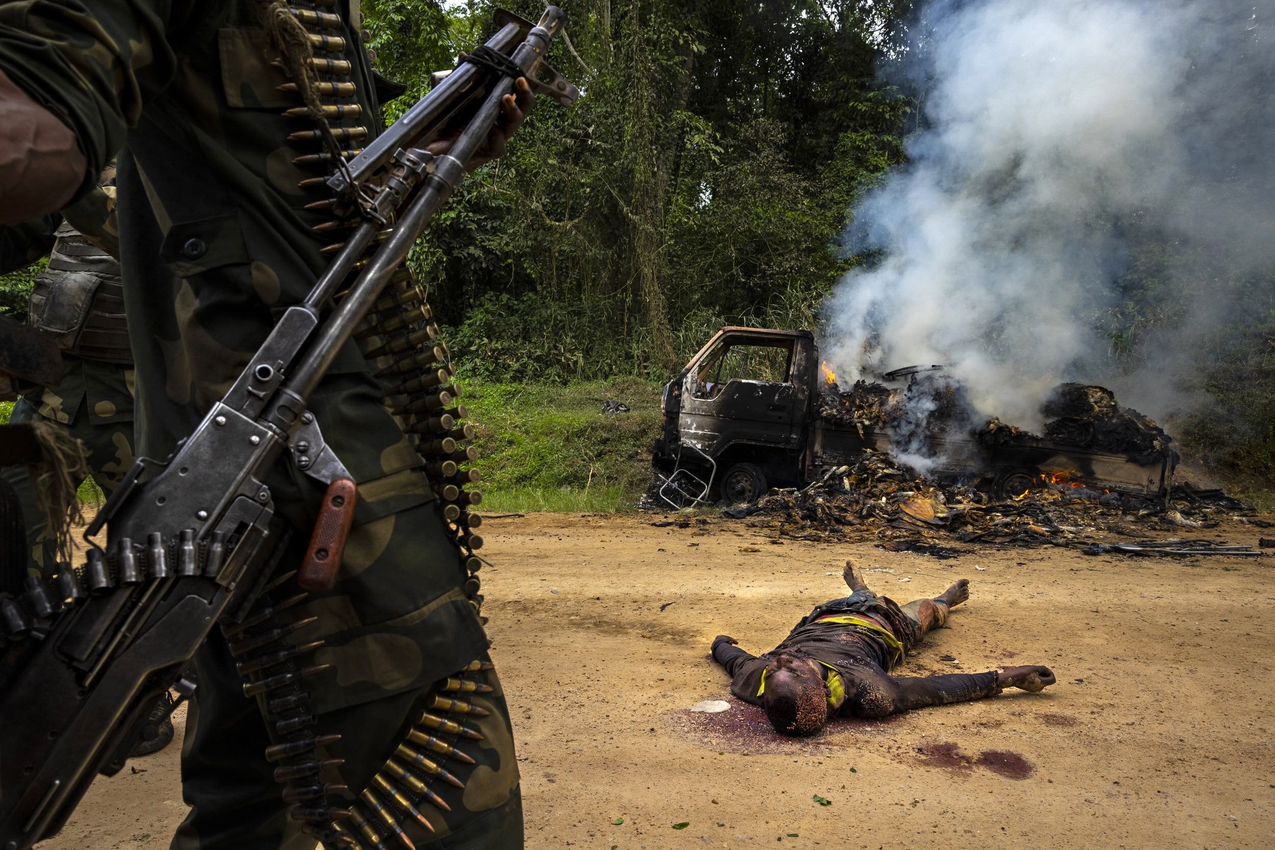 KILYA, RWENZORI SECTOR, DEMOCRATIC REPUBLIC OF CONGO, 9 APRIL 2021: Congolese Army soldiers and UN forces inspect an ambush site where an hour previously A.D.F fundamentalist rebels attacked two vehicles on the road between Beni and the Ugandan bord