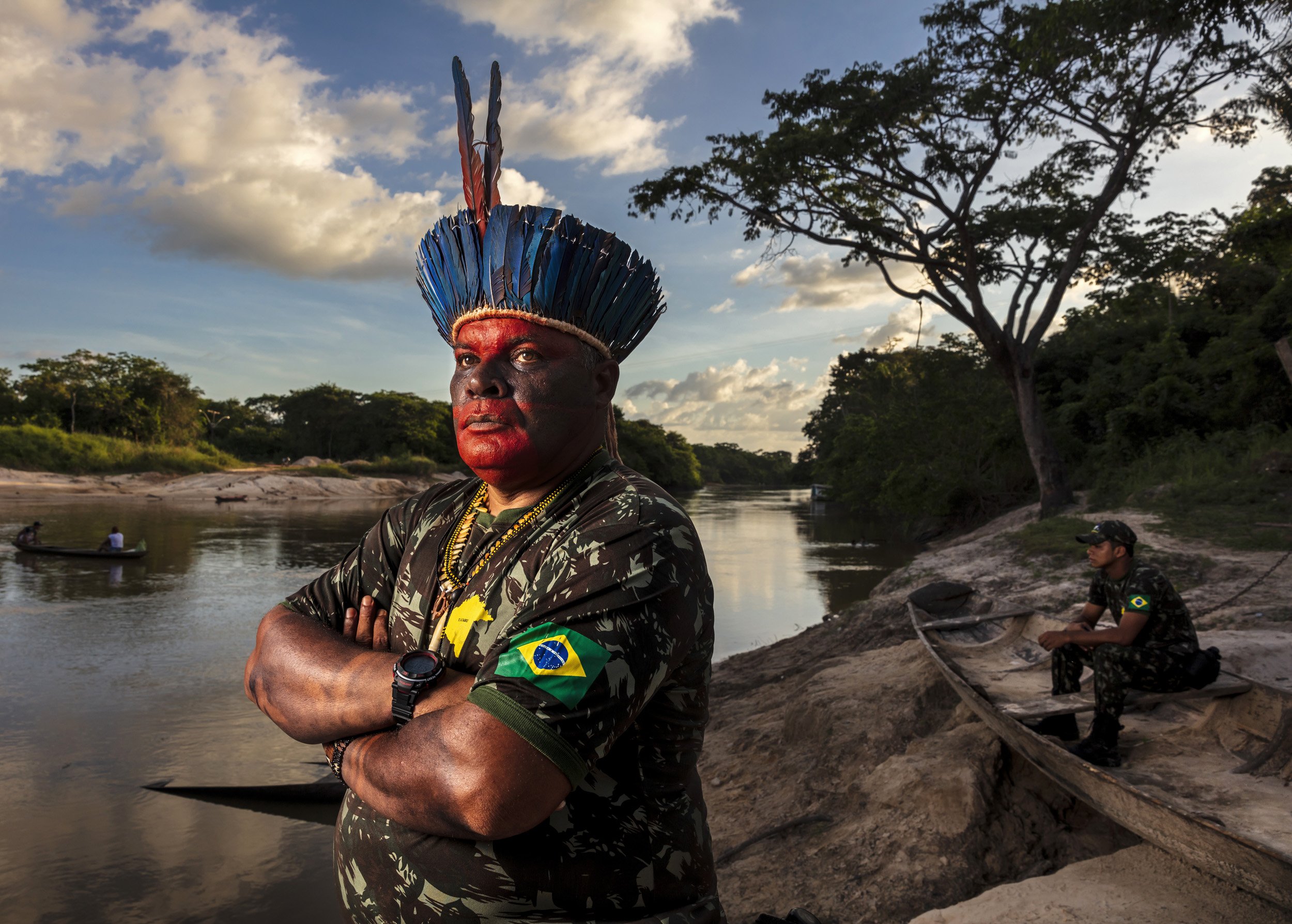 MARANHAO, BRAZIL, JUNE 2018: Chief Antonio Wilson Guajajara from the village of Macaranduba in the Karu Indigenous Territory. He is seen being painted in traditional patterns before a patrol and also on the bank of the river flowing through his terr