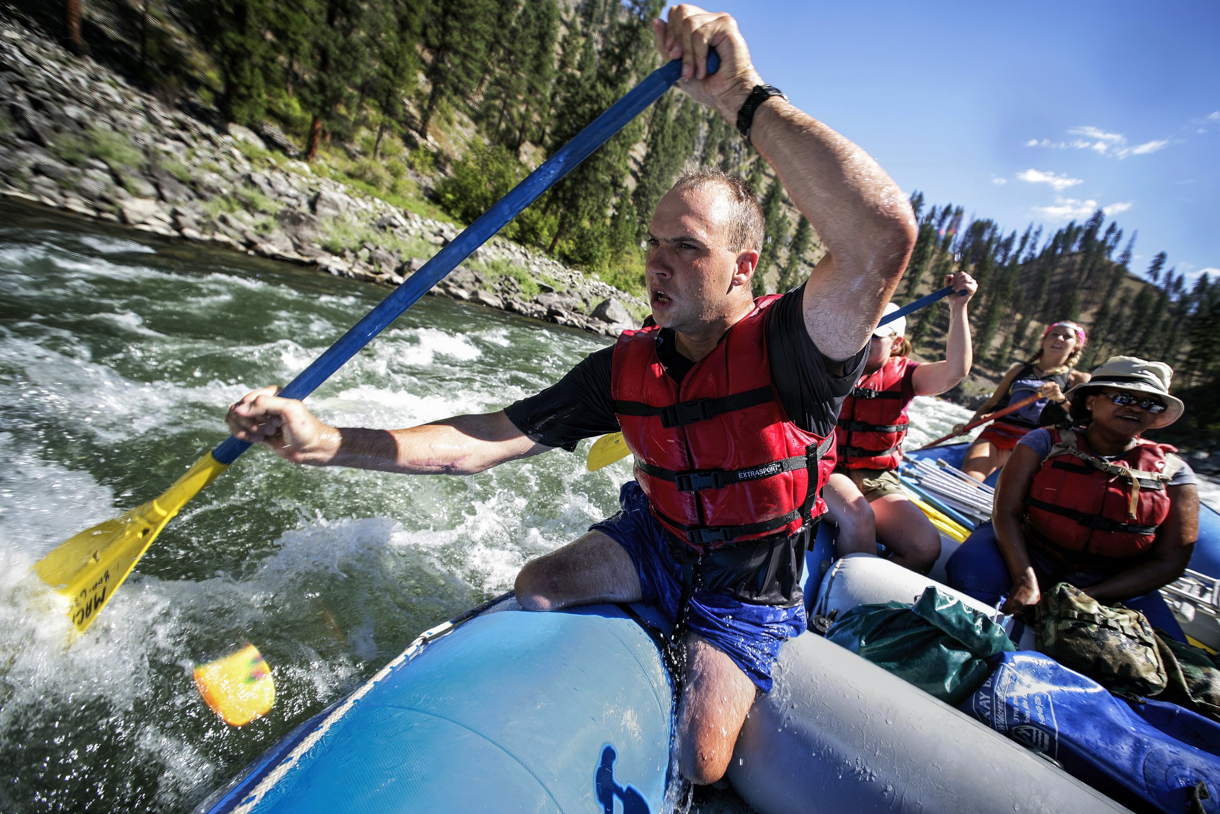SALMON RIVER IDAHO - AUGUST 8/14 2006: Specialist Andew W. Soule, 25, paddles through rapids as part of a 4 day river rafting trip on the Main Salmon River in Idaho. These images focus on a week outdoors with three disabled war wounded veterans from