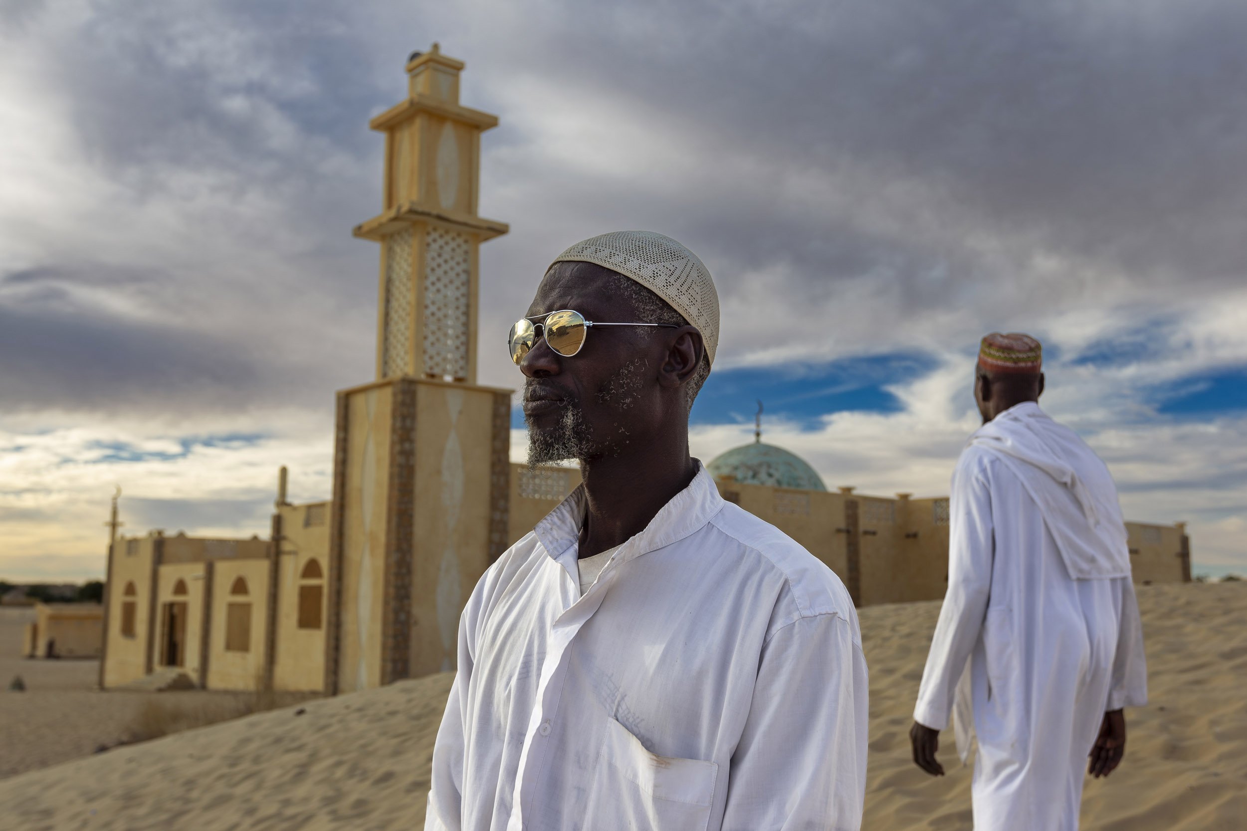 TIMBUKTU, MALI, JANUARY 2010: A Mosque and two muslims on the outskirts of Timbuktu, the mythical Northern Mali city, 23 January 2010. (Photo by Brent Stirton/Reportage by Getty images.)