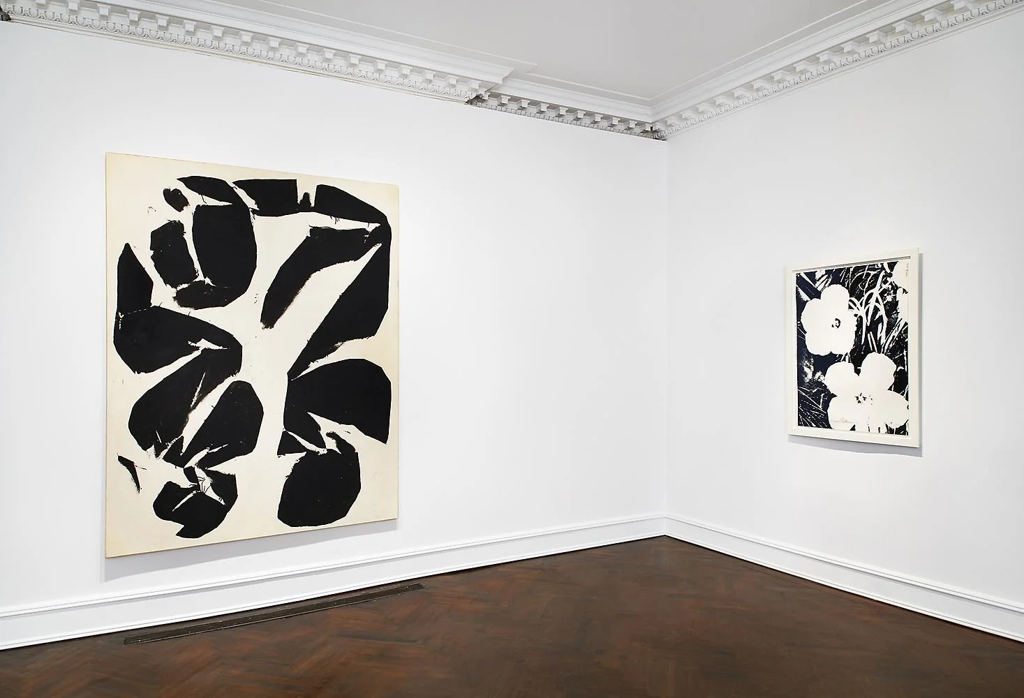 (Left to right) Simon Hantaï (1922-2008). Meun, 1968, oil on canvas, 86 x 71 inches ; Andy Warhol (1928-1987). Flowers, 1964, unique screenprint on Strathmore paper, 40 x 30 inches. Mnuchin Gallery, New York.