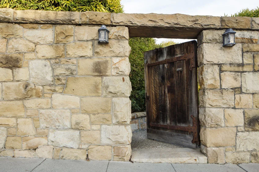 Wood door entry in a sandstone wall