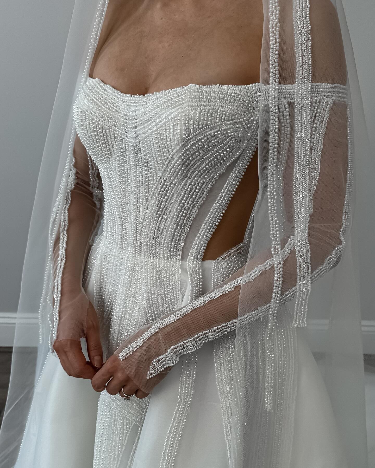 Stunning close-ups of our Alexa gown! ✨

Alexa&rsquo;s modern elegance is sure to turn heads. The structured bodice creates a flattering silhouette, while the long sleeves add a touch of sophistication. Complete the look with the matching veil for a 