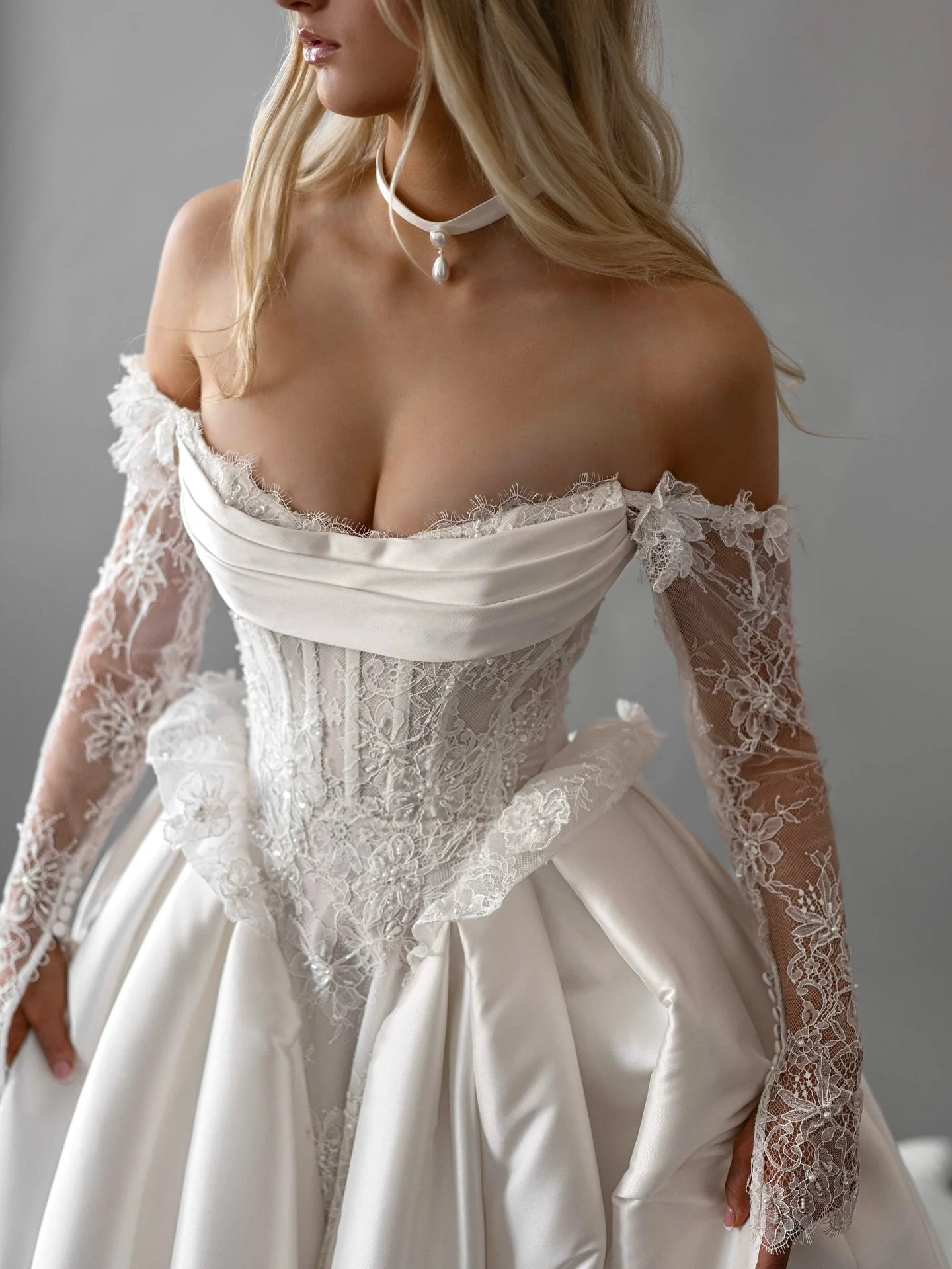 I M O G E N &mdash; bold, sculpted, and softly romantic.
From her corseted lace bodice to the pleated mikado skirt, every detail is made to shape, move, and captivate. Finished with 3D floral sleeves that add a whisper of whimsy. ✨

💫 Come try her o