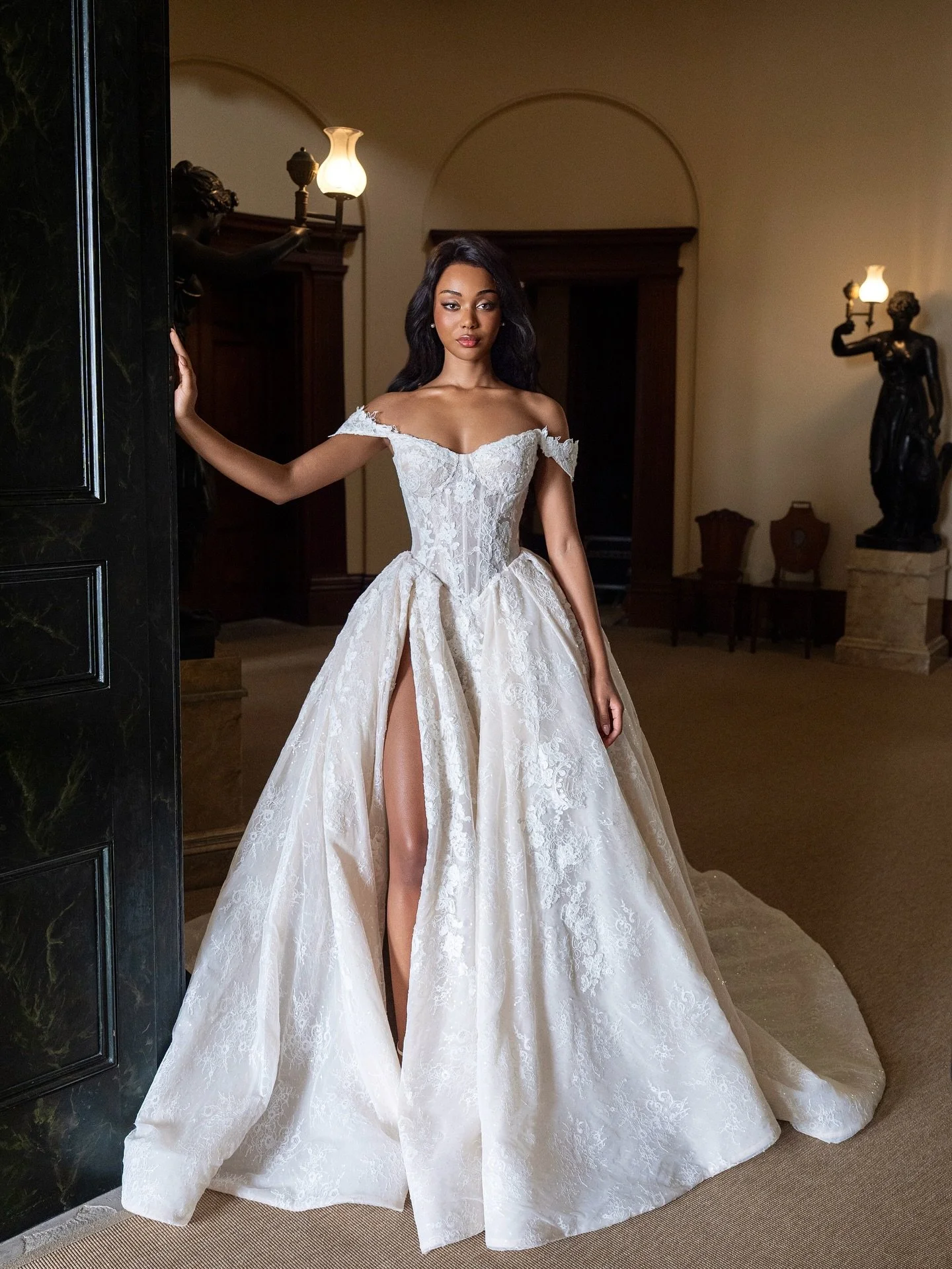 R O S A L I E &mdash; pure romantic decadence ✨

Designed in a soft champagne hue that glows with quiet luxury, her sequined Chantilly lace shimmers beneath layers of ornate detail. 

Off-shoulder straps, a daring leg split, and a sweeping train brin