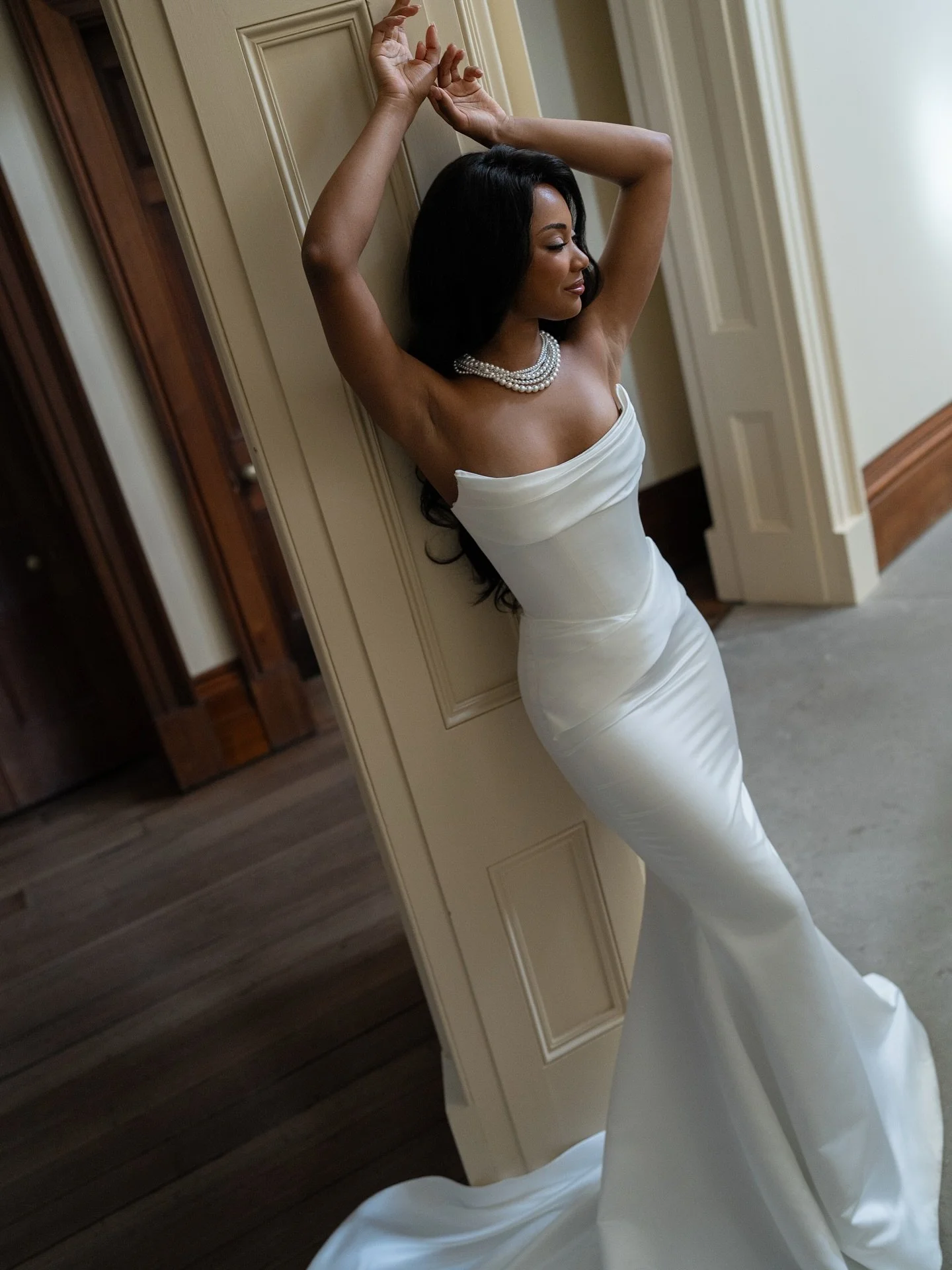 Meet Alexandra ✨ 

Effortless elegance meets modern allure. Crafted in luminous satin, she drapes like liquid light with a sculpted corset and soft, romantic draping across the neckline. 

Finished with a lace-up back and a sweeping train &mdash; tim