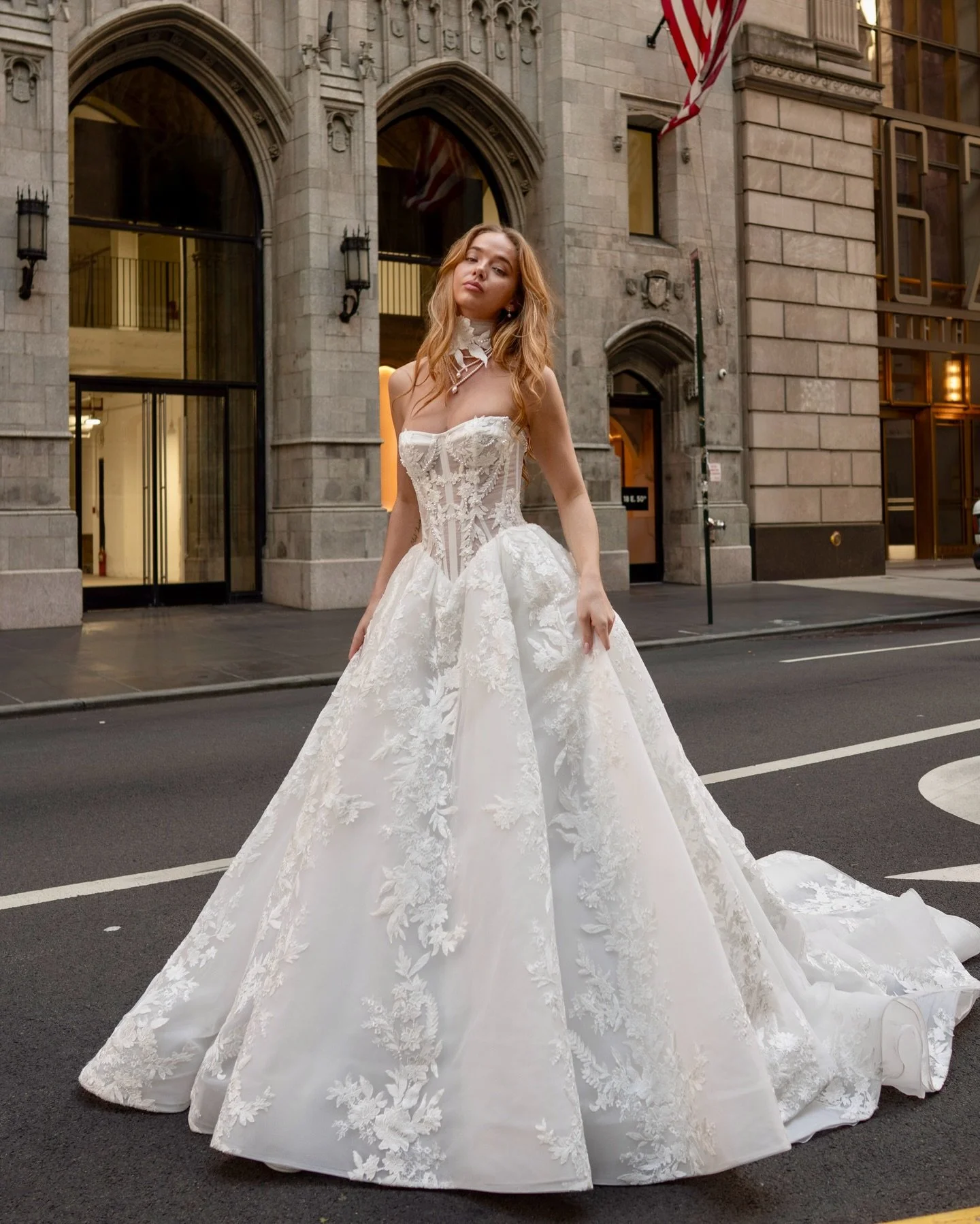 G A B R I E L L A ✨ 

Serving full fairytale energy on the streets of New York. Her sculpted bodice, embossed floral lace, and dramatic skirt turn the whole city into her runway. Bold, romantic, and pure main-character magic 🤍 

Ready to meet her in