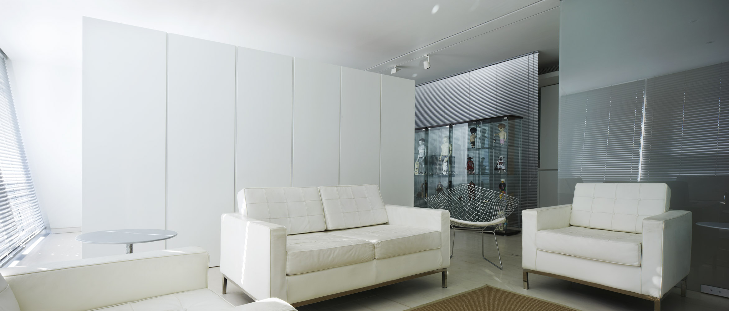The freestanding high gloss lacquer unit was added to provide extra storage.