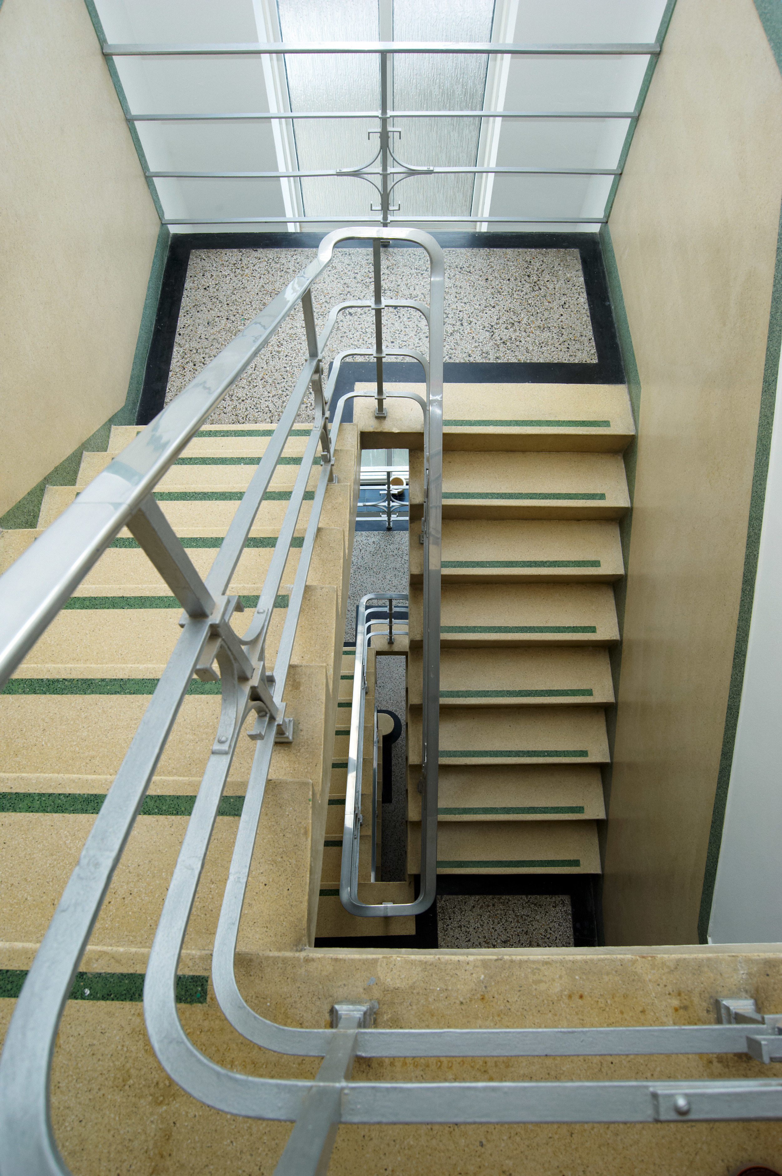 A detail of the original art-deco main staircase in Sandbanks Court .