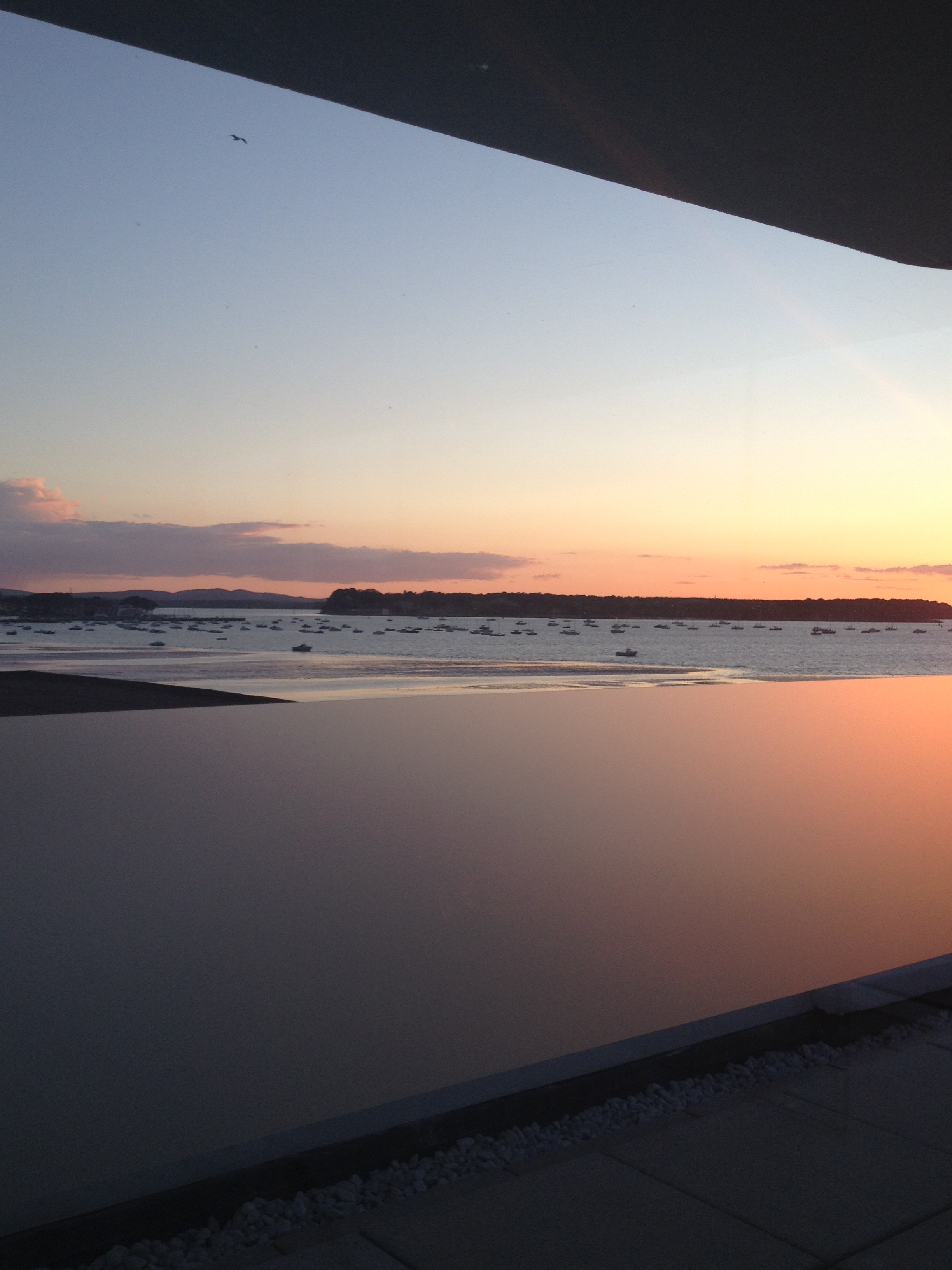 Sunset view over Poole Harbour towards Brownsea Island .