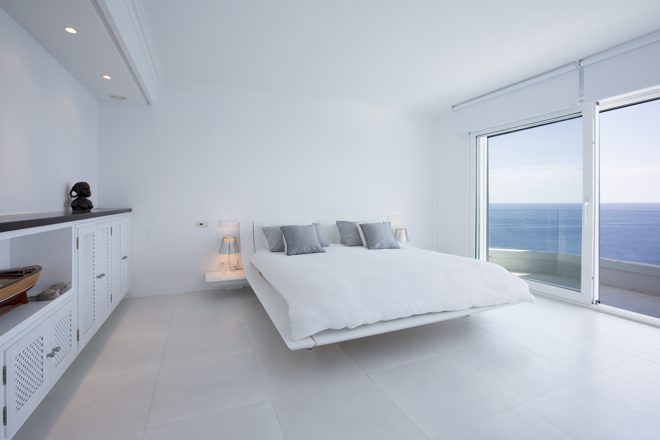 A new balcony was added to the master bedroom with full width sliding doors and electric external shutter and internal roller blinds .Floors throughout both inside and out are tiled in white .