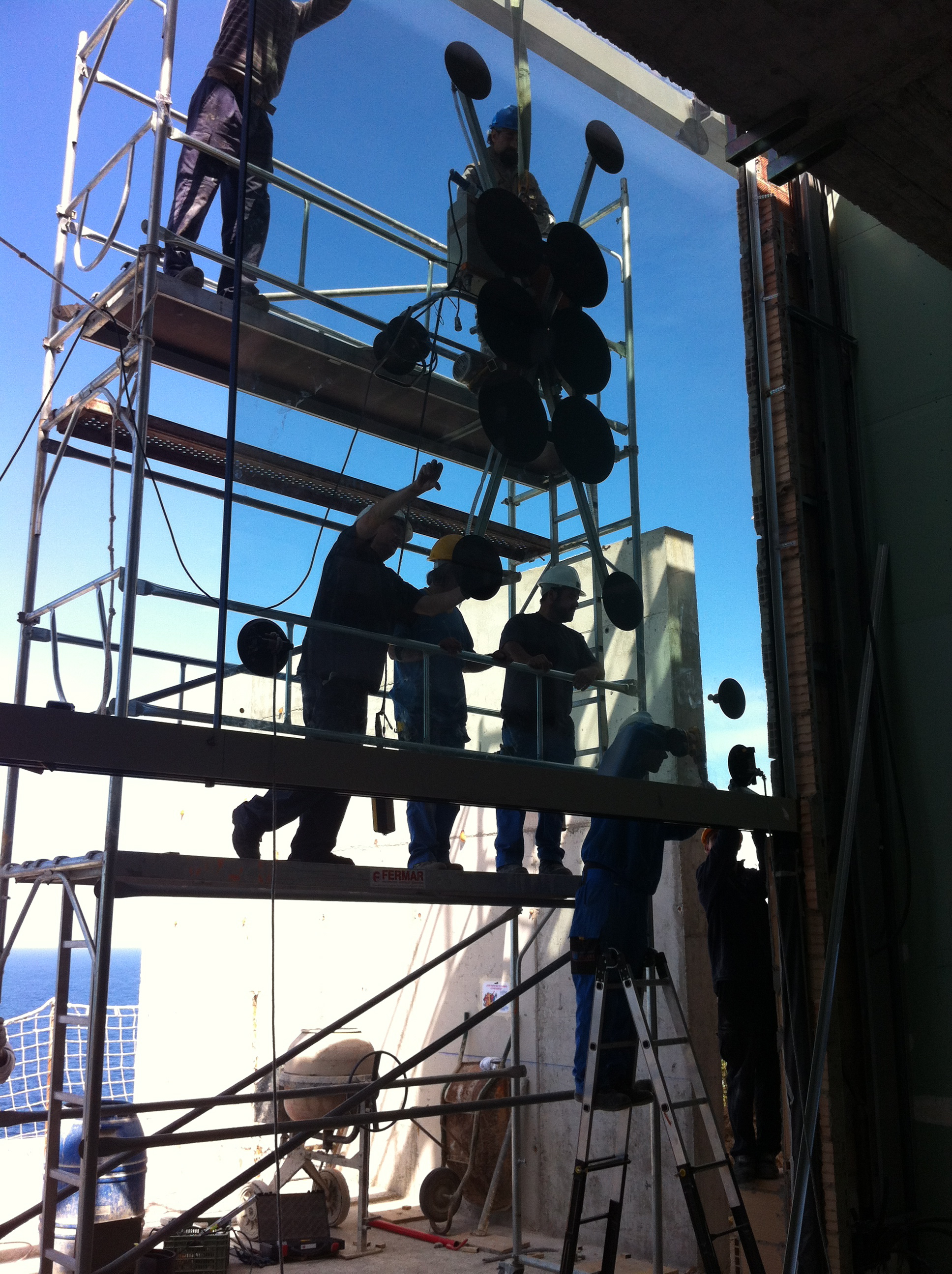 Installing the huge 4.4m x 3.2m double glazed units to the main facade 