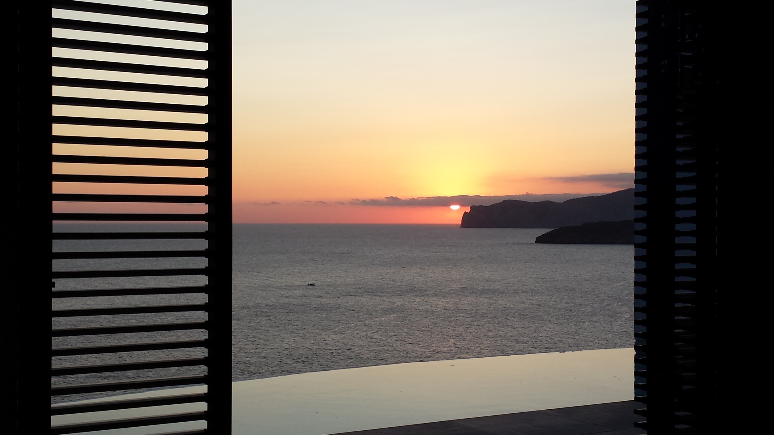 View from first floor bedroom at sunset .