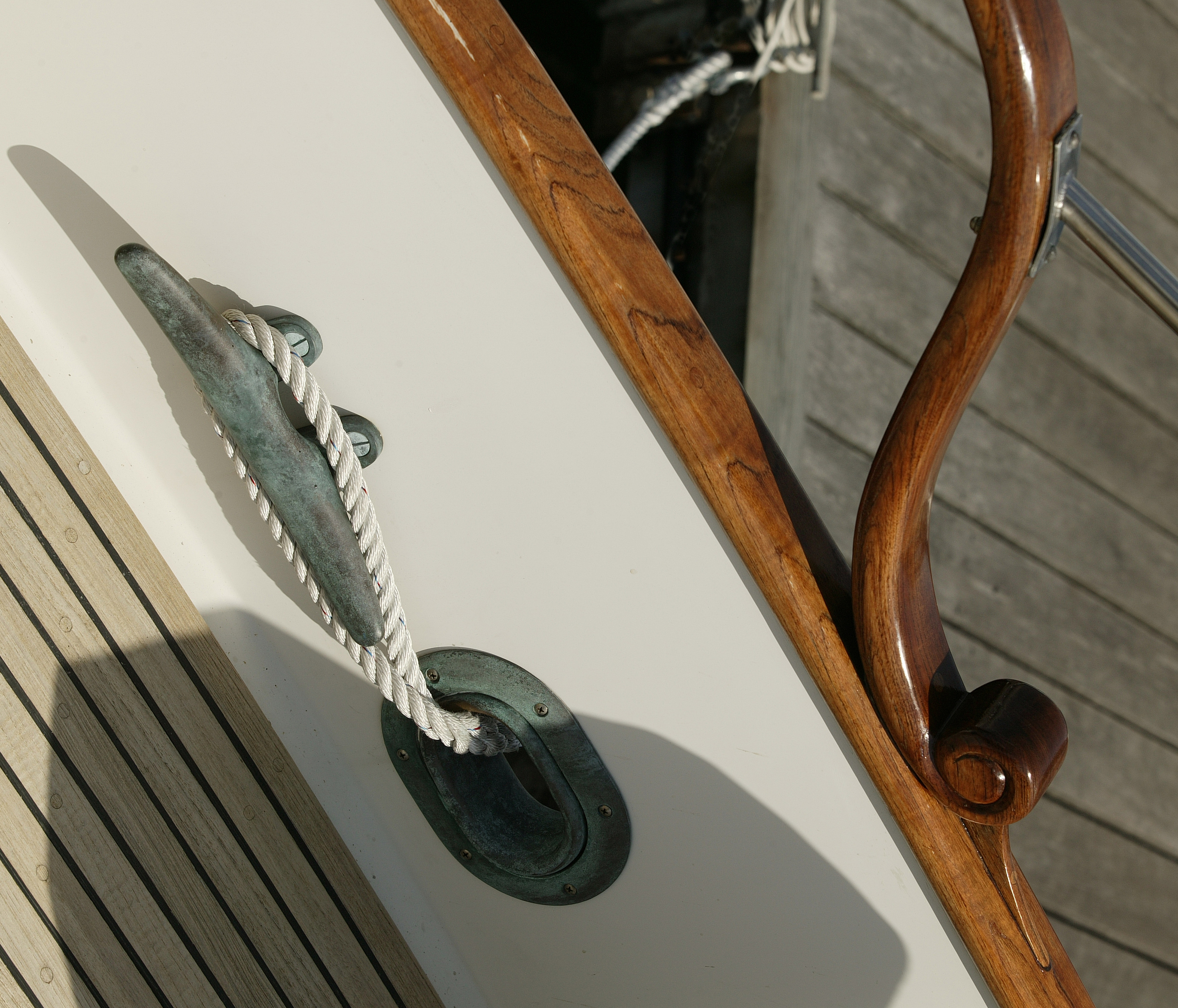 Original fair leads and cleats in cast bronze with teak rails and decking.