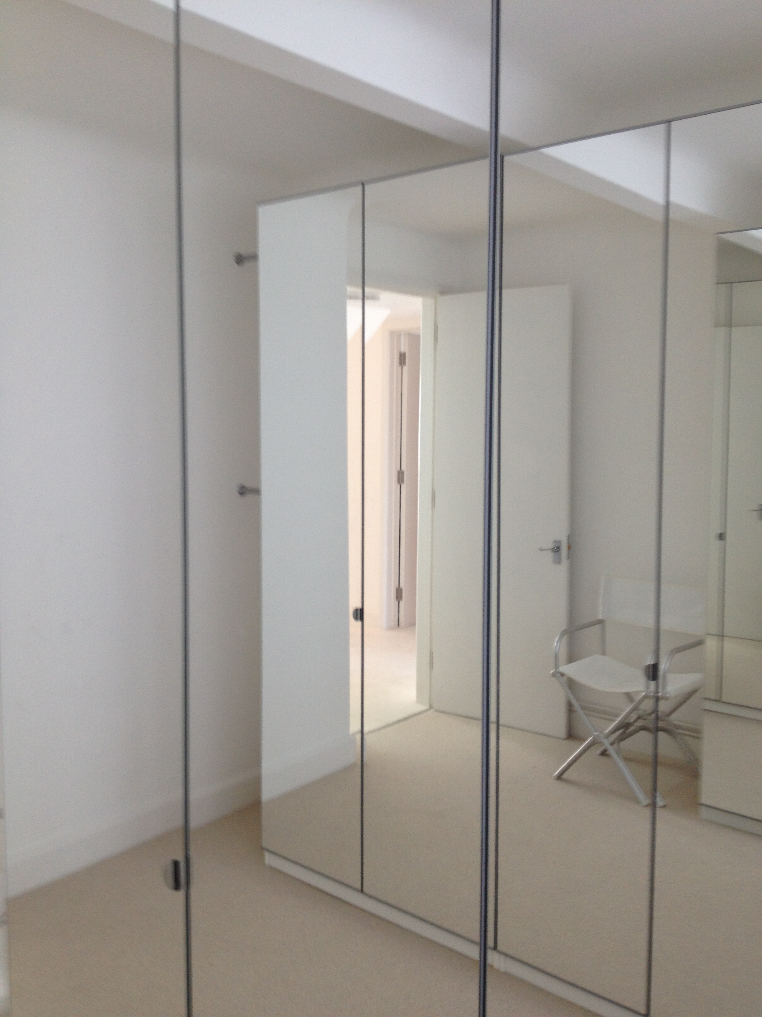 Flat 9 mirrored storage to dressing room.