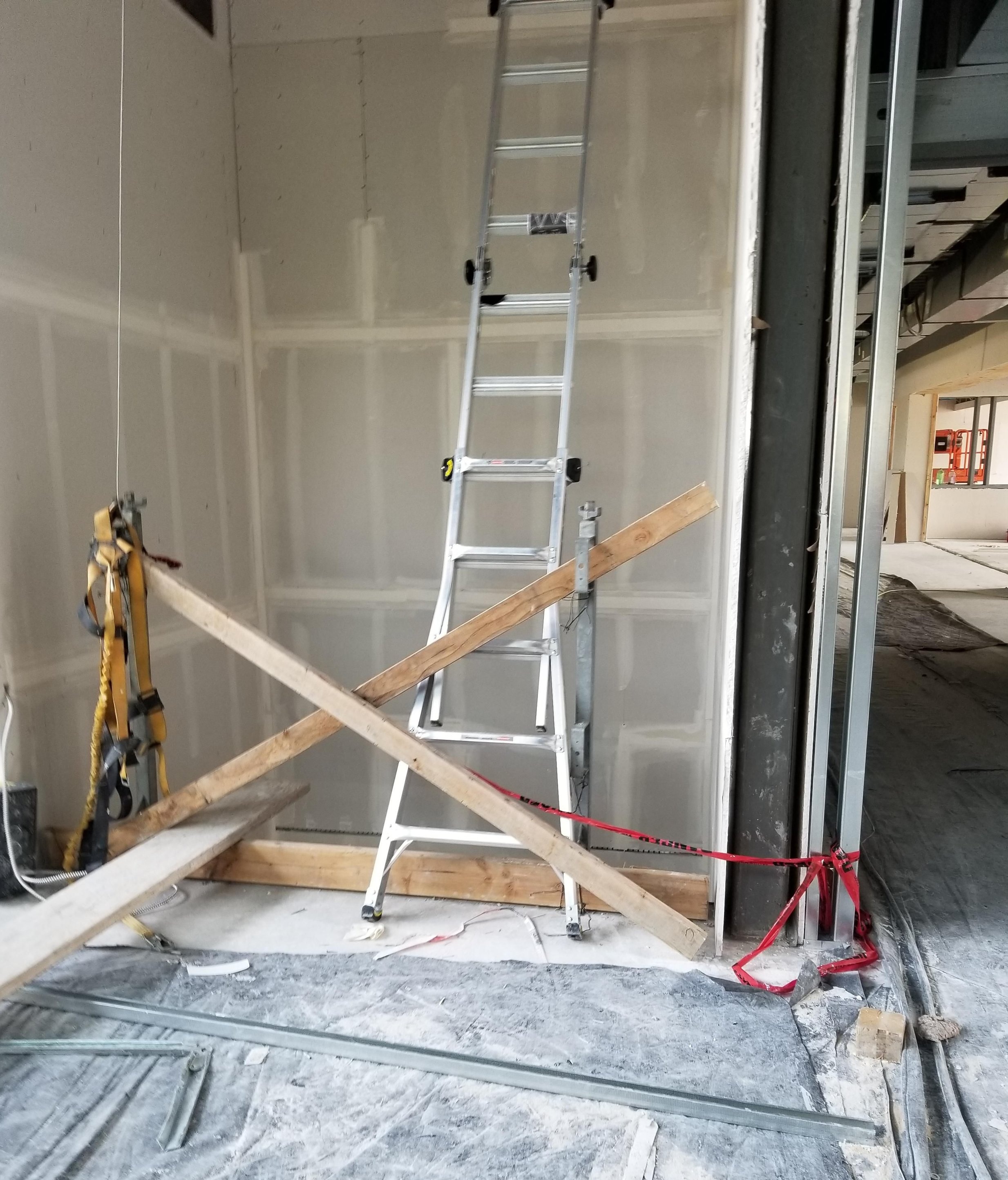 This is one of those WTF photos. What' you’re looking at is a ladder for a drywall installer and it spanning the opening of an elevator shaft. The barricade is also ridiculous.