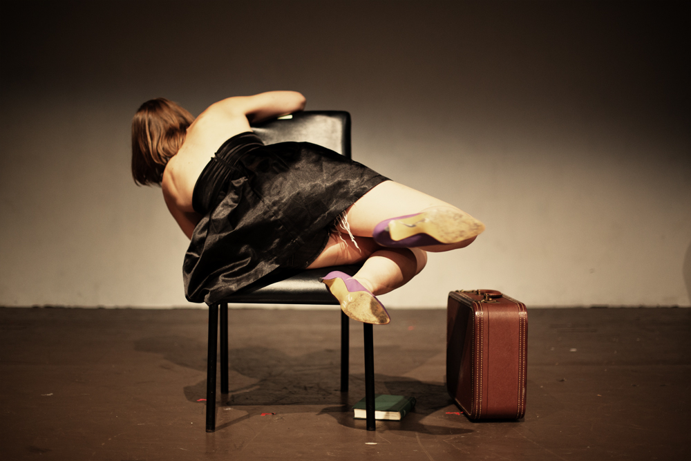 ass in chair dance with suitcase.jpg