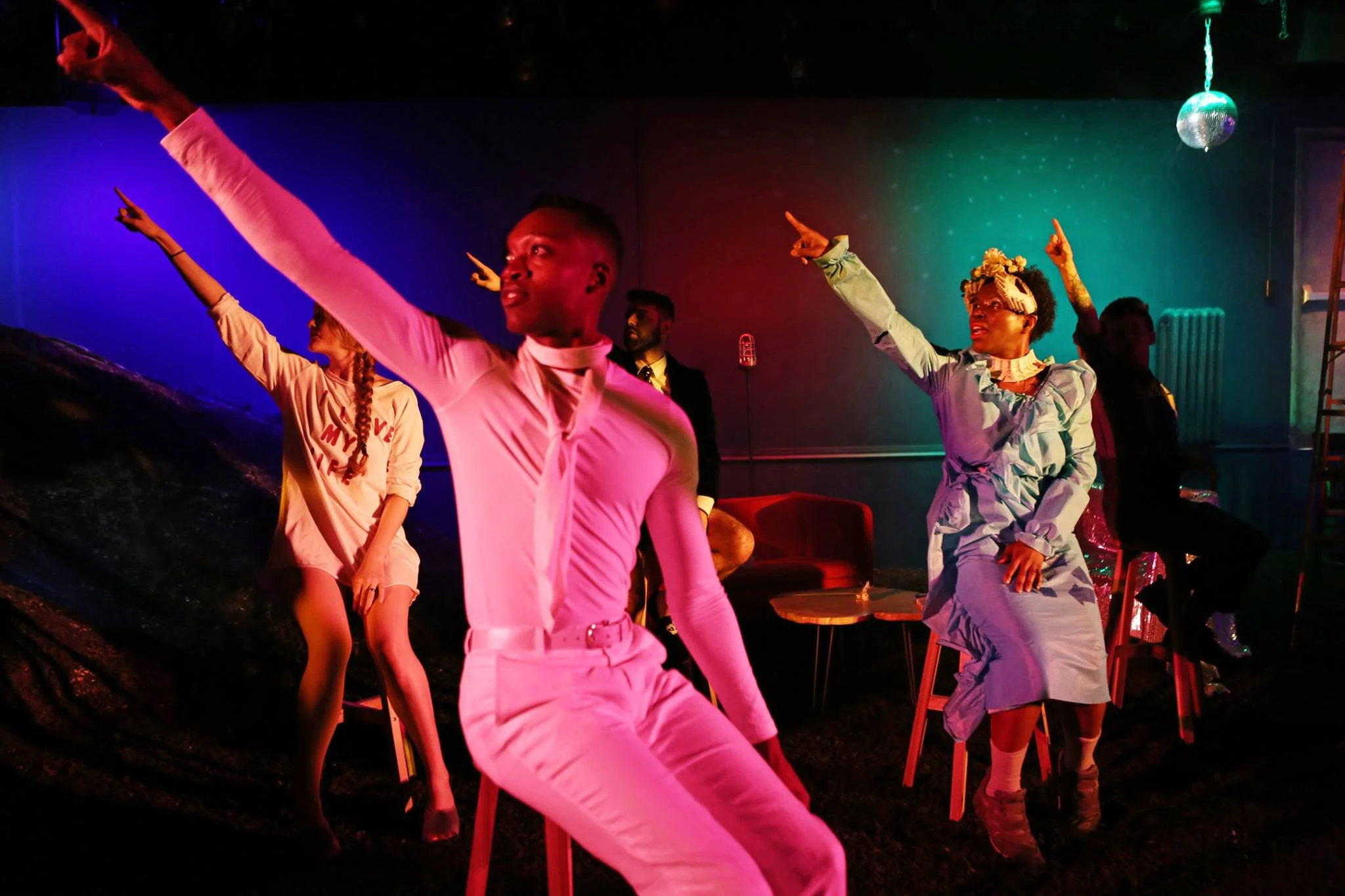 Left to right: Emily Davis, Ato Blankson-Wood, Tommy Heleringer, Julienne "Mizz June" Brown, Jess Barbagallo in O, Earth at HERE, produced by The Foundry Theatre. Everyone is seated in stools pointing toward the top left. Photo by Julieta Cervantes.