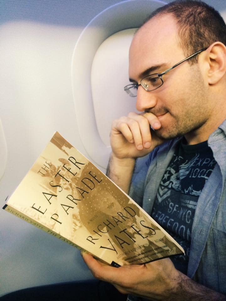 En route JFK --> LAX. The web editor harassing the fiction editor, Michael Sarinsky, who is trying to do his homework for Zadie Smith's class.