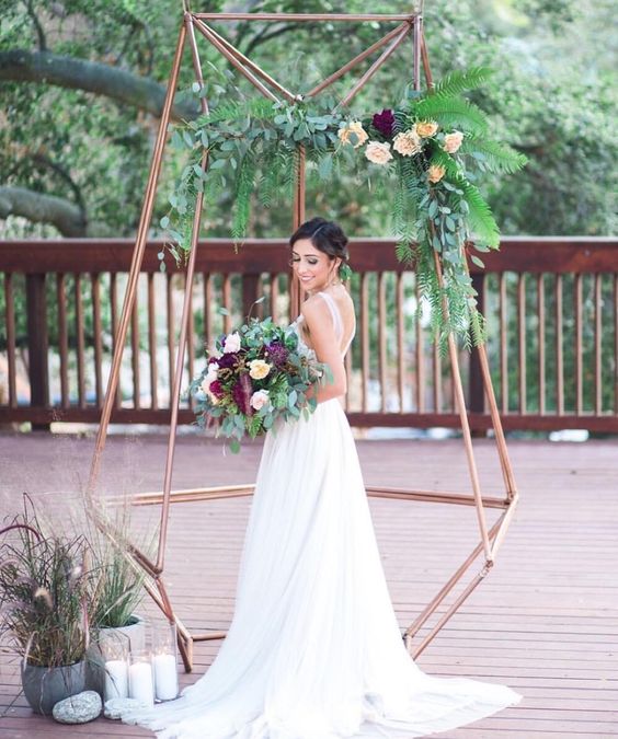 29-copper-dimensional-wedding-arbor-with-greenery-and-flowers-for-a-modern-feel.jpg