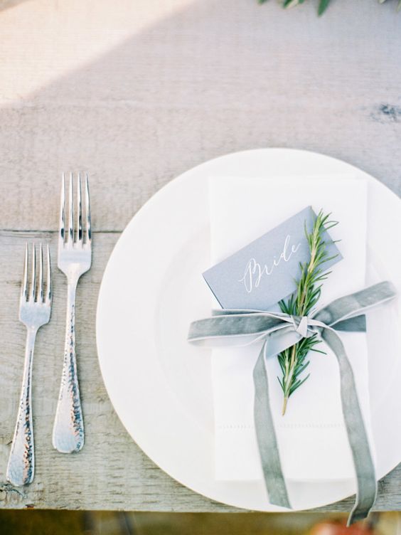20-a-minimalist-table-setting-with-a-white-napkin-and-a-dusty-blue-velvet-ribbon.jpg