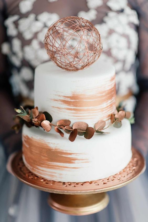 41-simple-chic-white-cake-with-a-modern-make-over-brushed-with-copper-strokes-and-adorned-with-copper-sprayed-eucalyptus.jpg