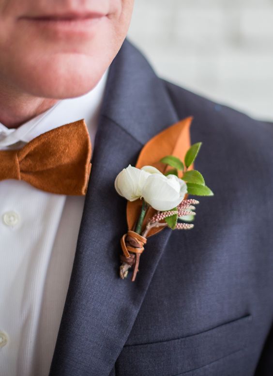 18-dark-grey-suit-a-copper-bow-tie-and-a-copper-and-white-boutonniere.jpg